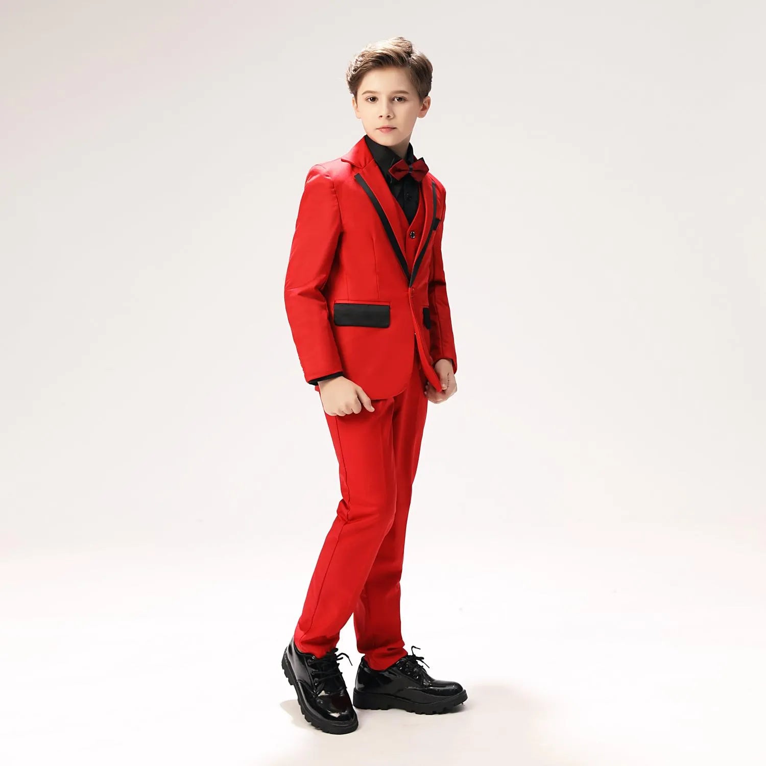 Red boys' prom suit side view - black trimmed blazer with bow tie & vest