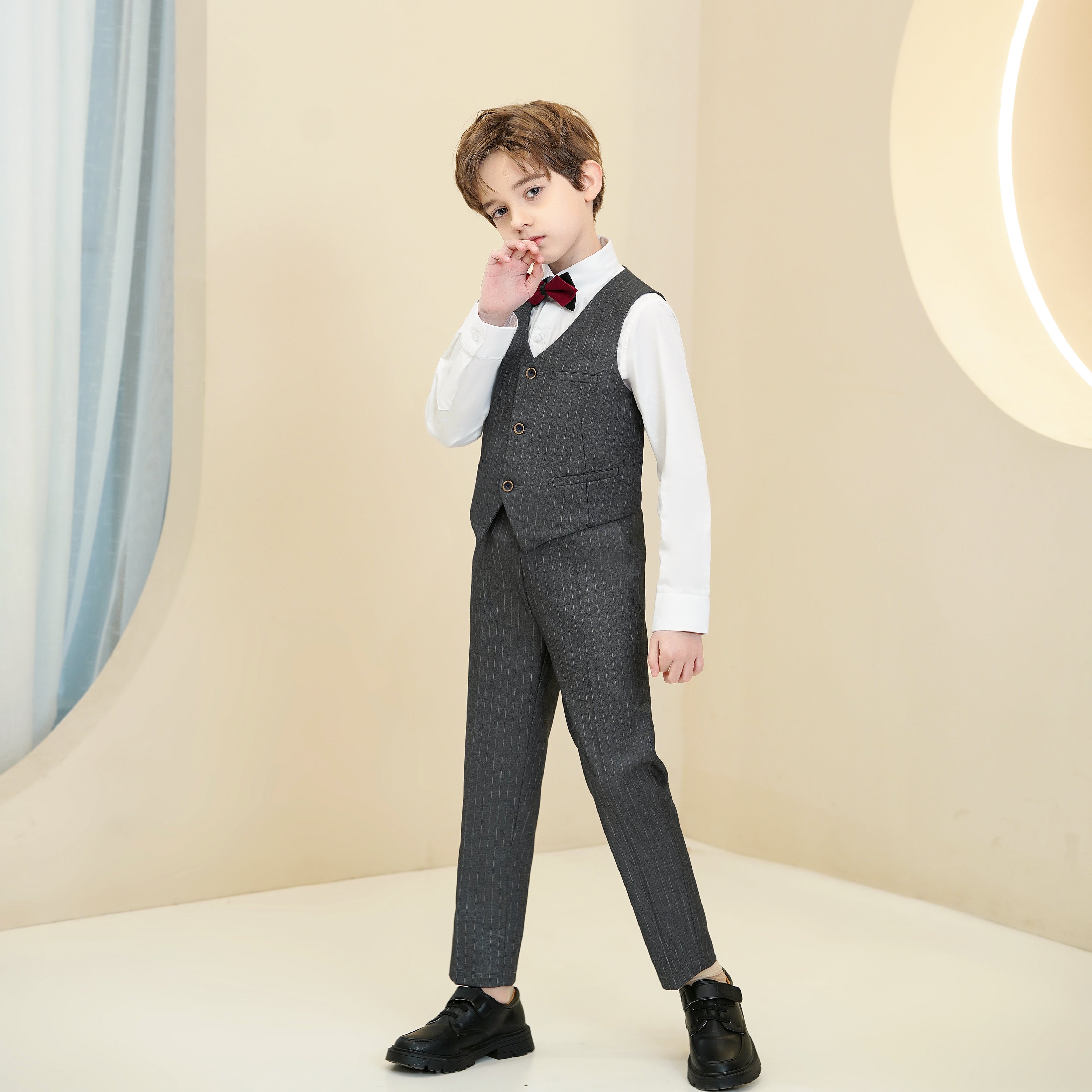Modern dark grey pinstripe boys' 4-piece formal suit with red bowtie, vest & white shirt for weddings