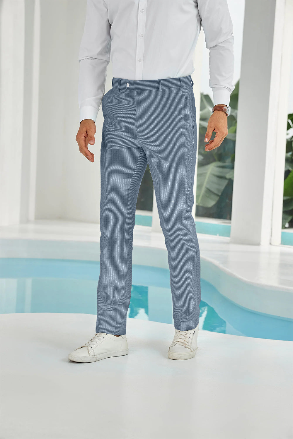 Front view of navy seersucker pants with subtle stripes and white shirt