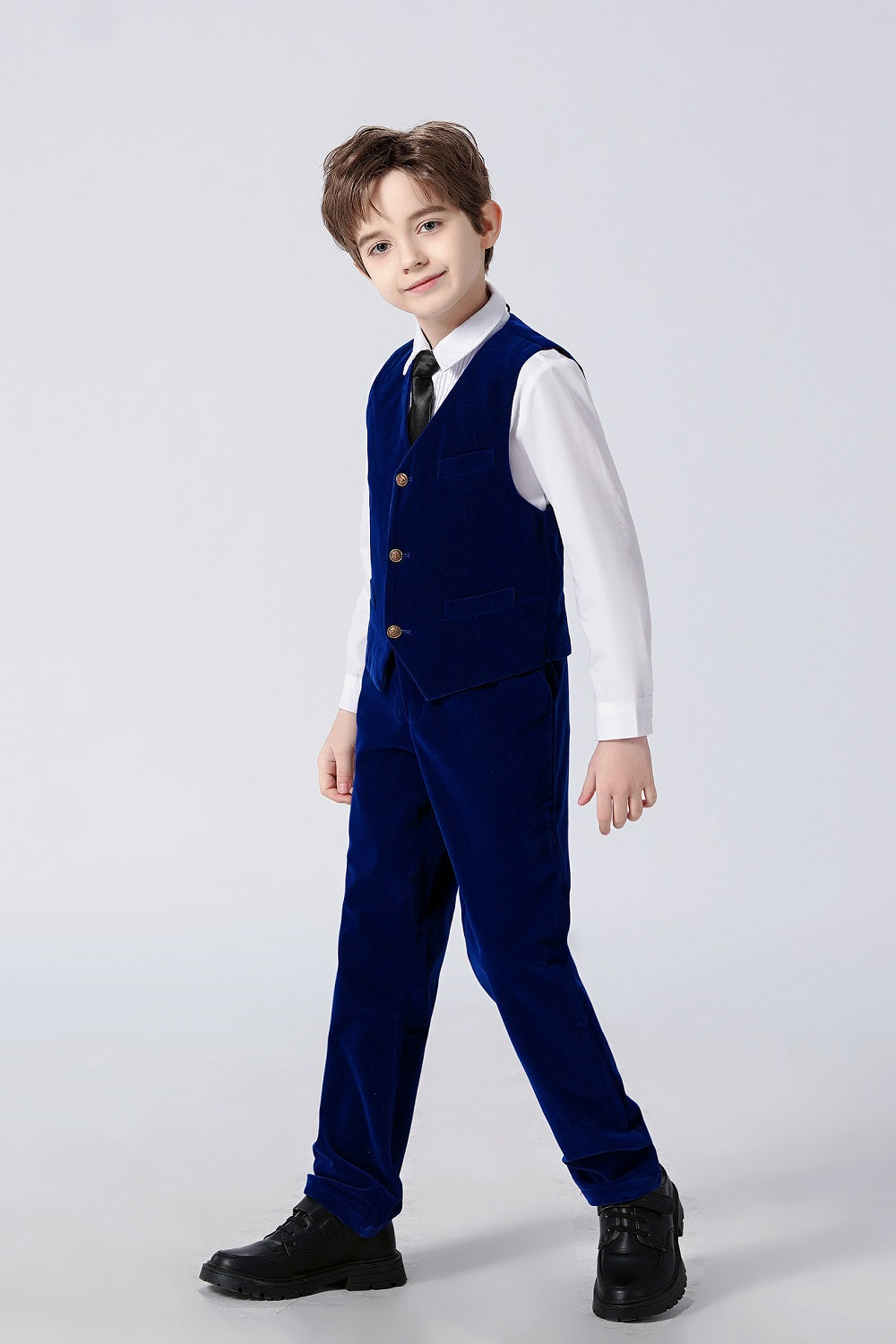 Boy wearing royal blue velvet vest & pants set with black tie – formal kid's dress suit