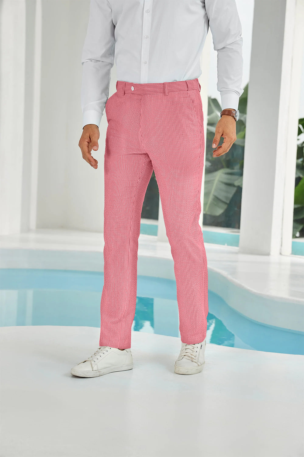Front view of red seersucker pants with subtle stripes and white shirt