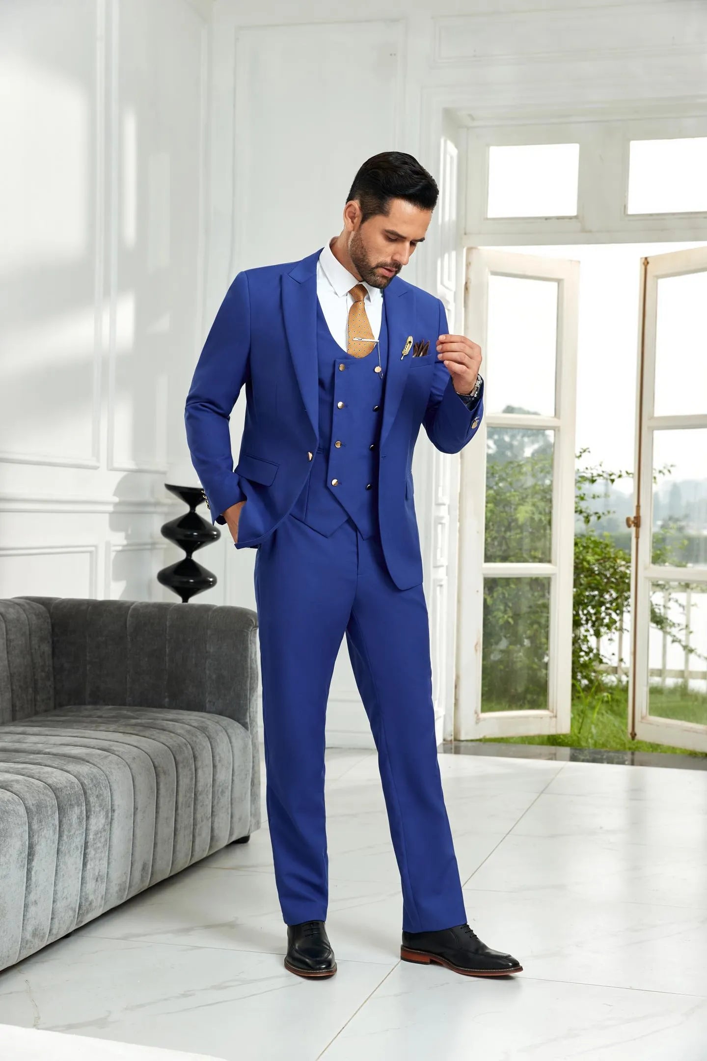Side angle of royal blue 3 piece men's suit with slim fit blazer, vest, and trousers, styled for modern wedding and business occasions.