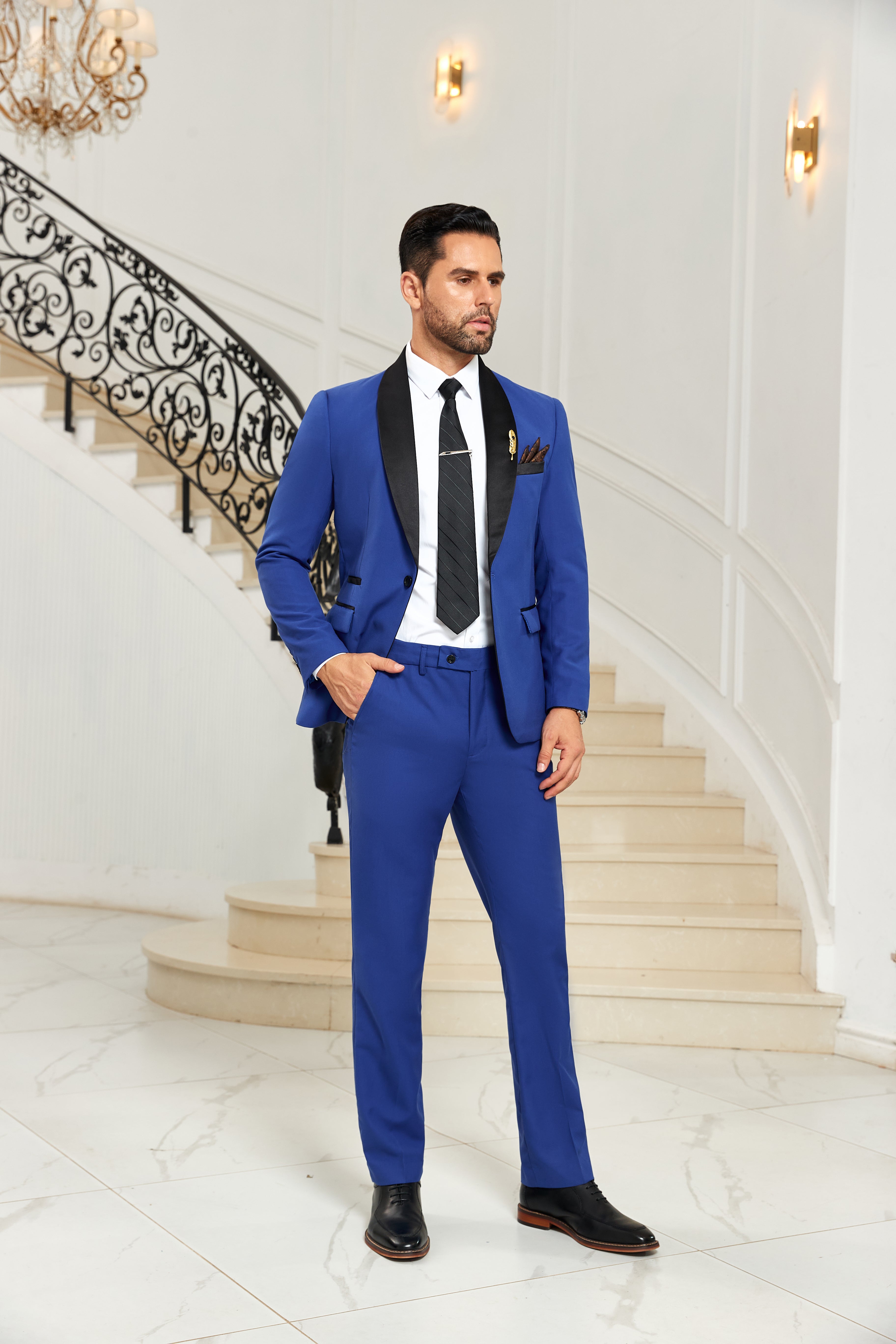 Side pose in royal blue and black lapel suit – tailored men’s partywear set