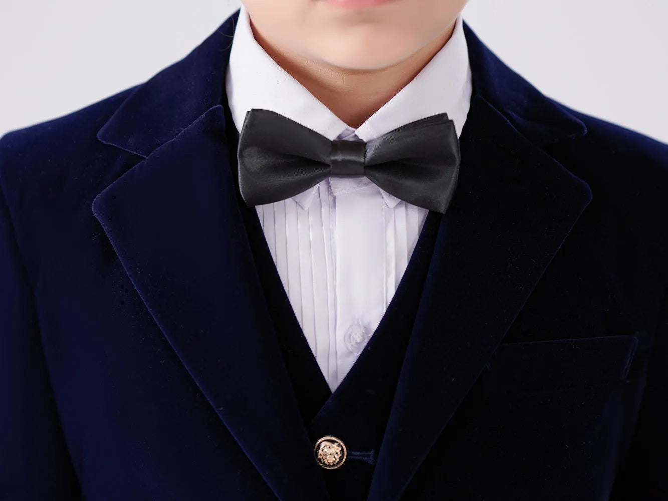 Boys' navy velvet tuxedo suit – structured back with clean seam and elegant tailoring