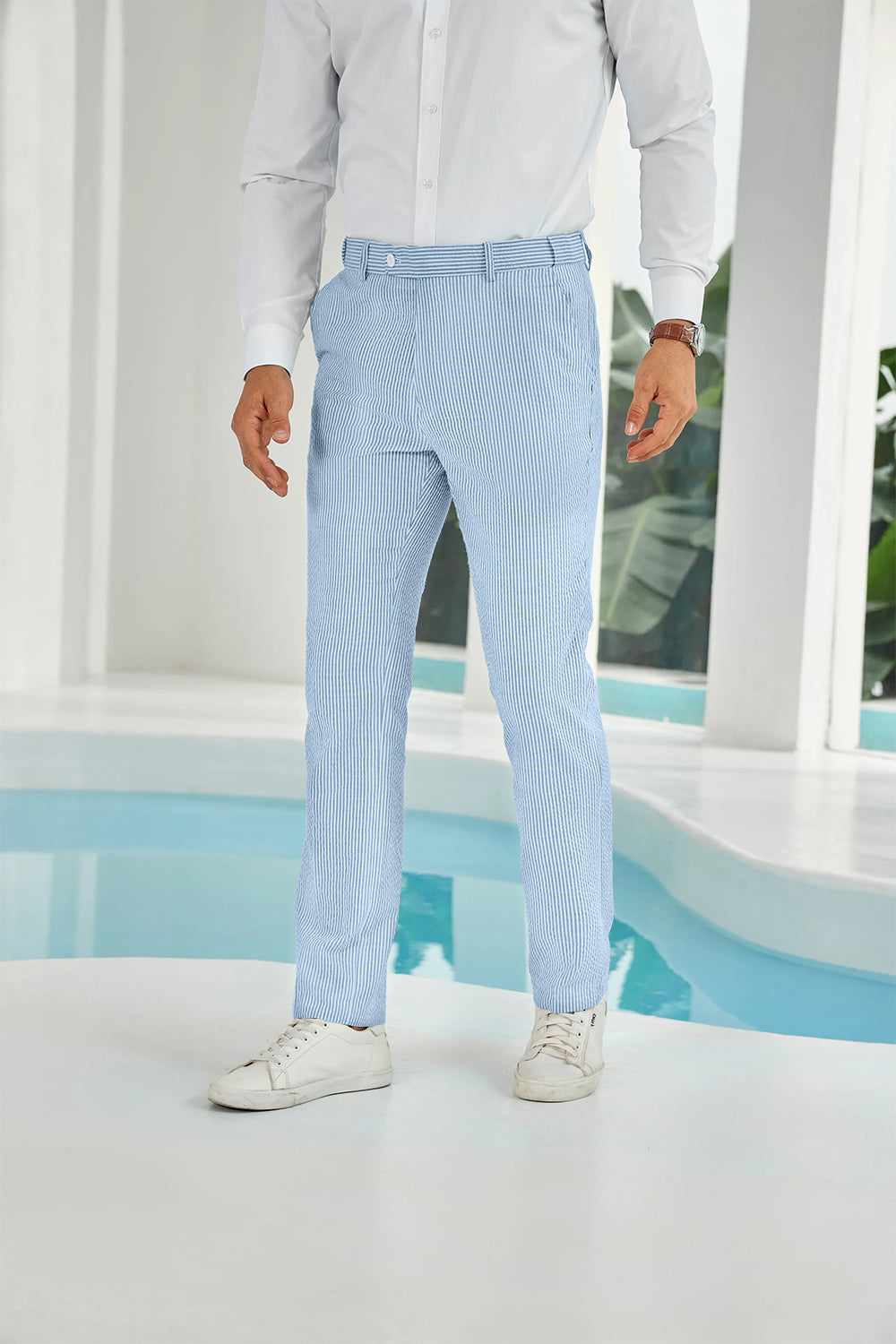 Front view of sky blue seersucker pants with subtle stripes and white shirt