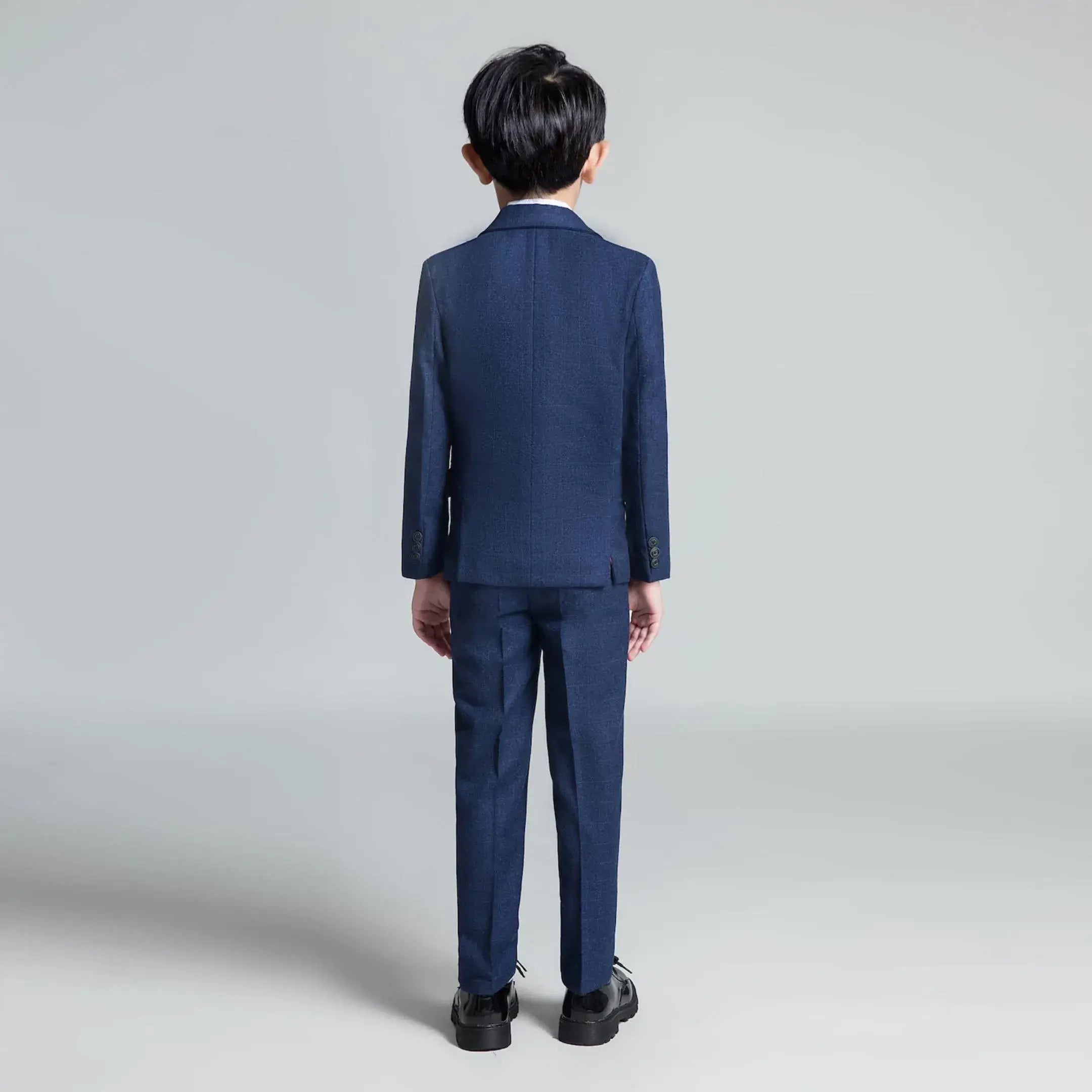 Back view of navy plaid boys blazer and trousers – classic party wear for kids