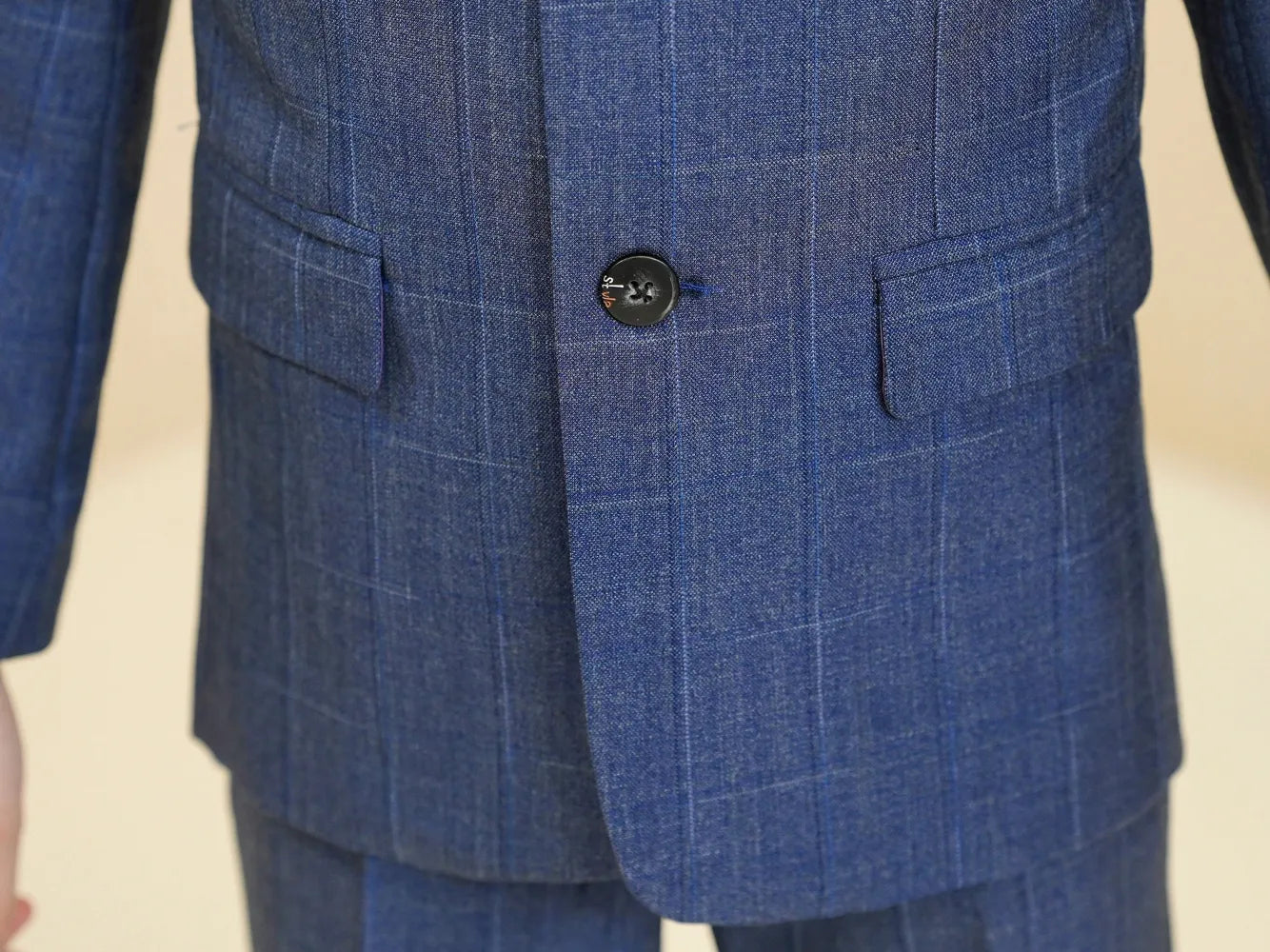 Kids blue plaid suit: Formal blazer with button & pocket detail - close-up