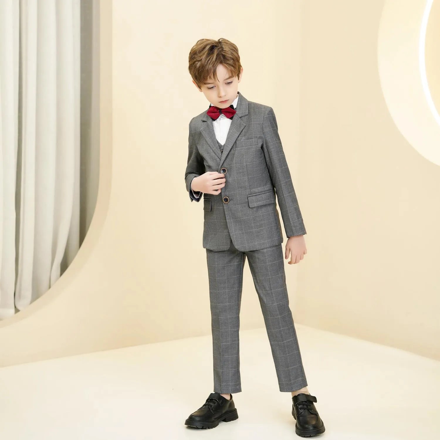 Grey plaid boys 5-piece suit: Front view with red bow tie & button detail