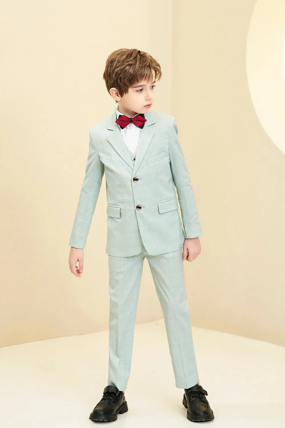 Mint green plaid boys 5-piece suit: Side pose with red bow tie & checked pattern
