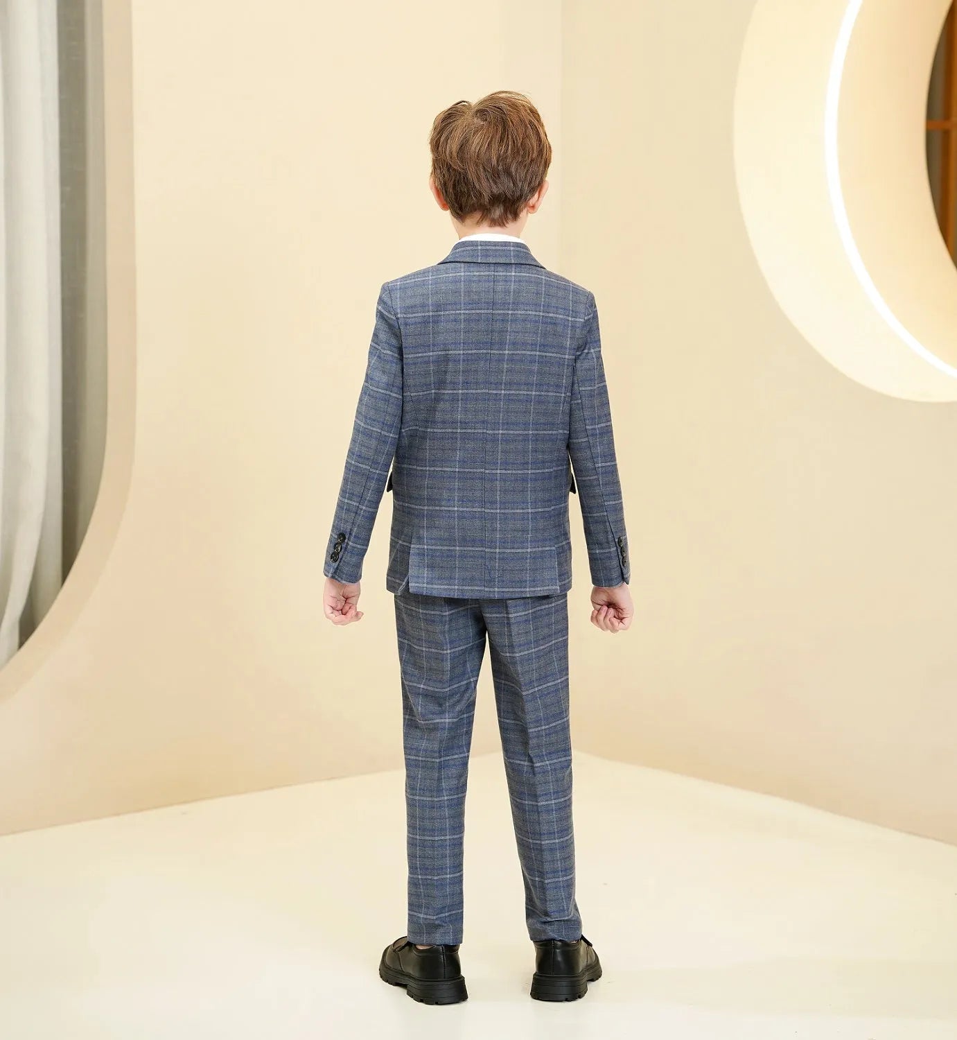 Back view of boys blue and white plaid 5 piece suit with classic tailored fit.