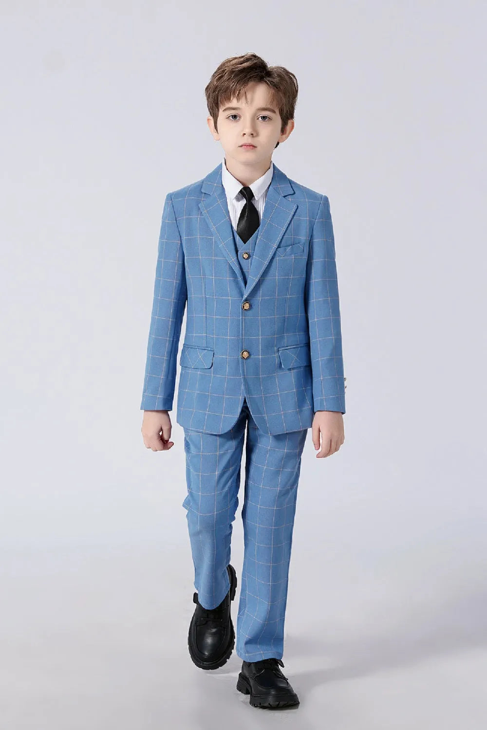 Boy wearing light blue plaid 5 piece suit with black tie, formal outfit ideal for weddings or special occasions