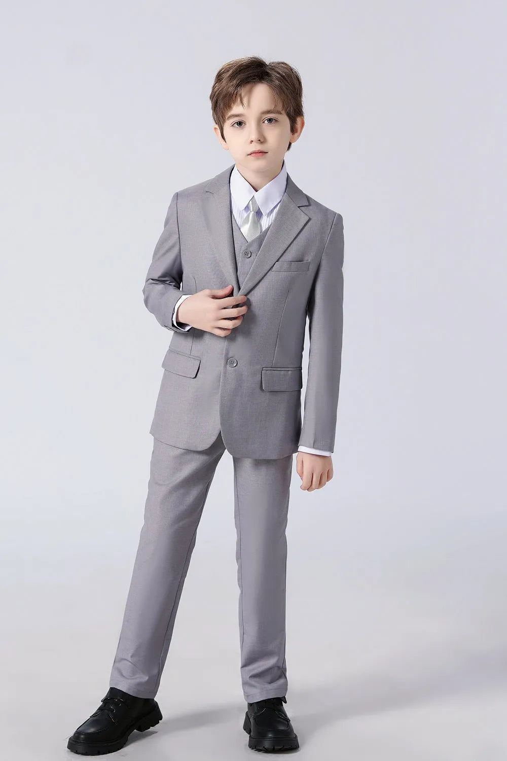 Light grey 5 piece boys suit set with blazer vest pants tie and shirt perfect for weddings and banquets