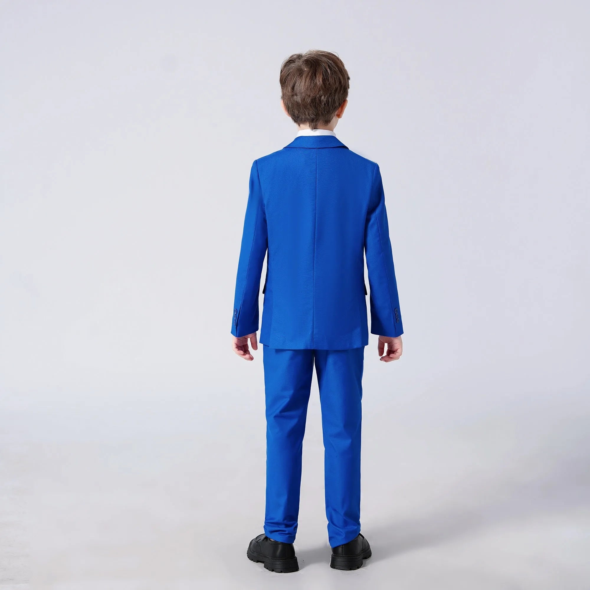 Back view of royal blue boys 5-piece suit with blazer and trousers – classic party or banquet attire