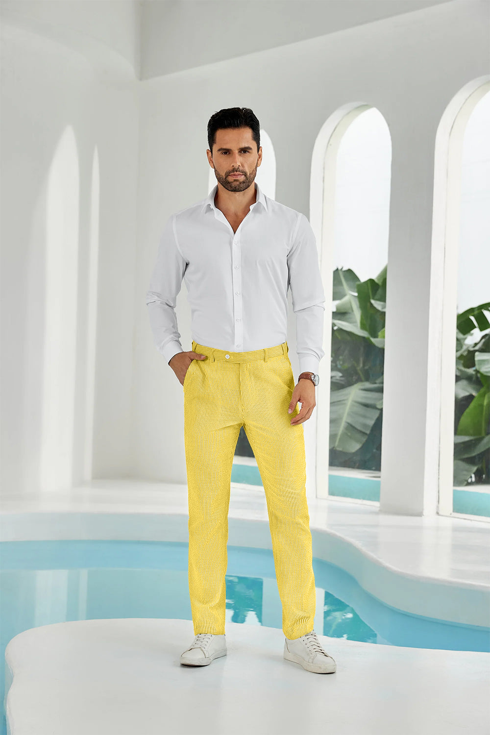 Full-body look: man in yellow seersucker pants, white shirt, and sneakers