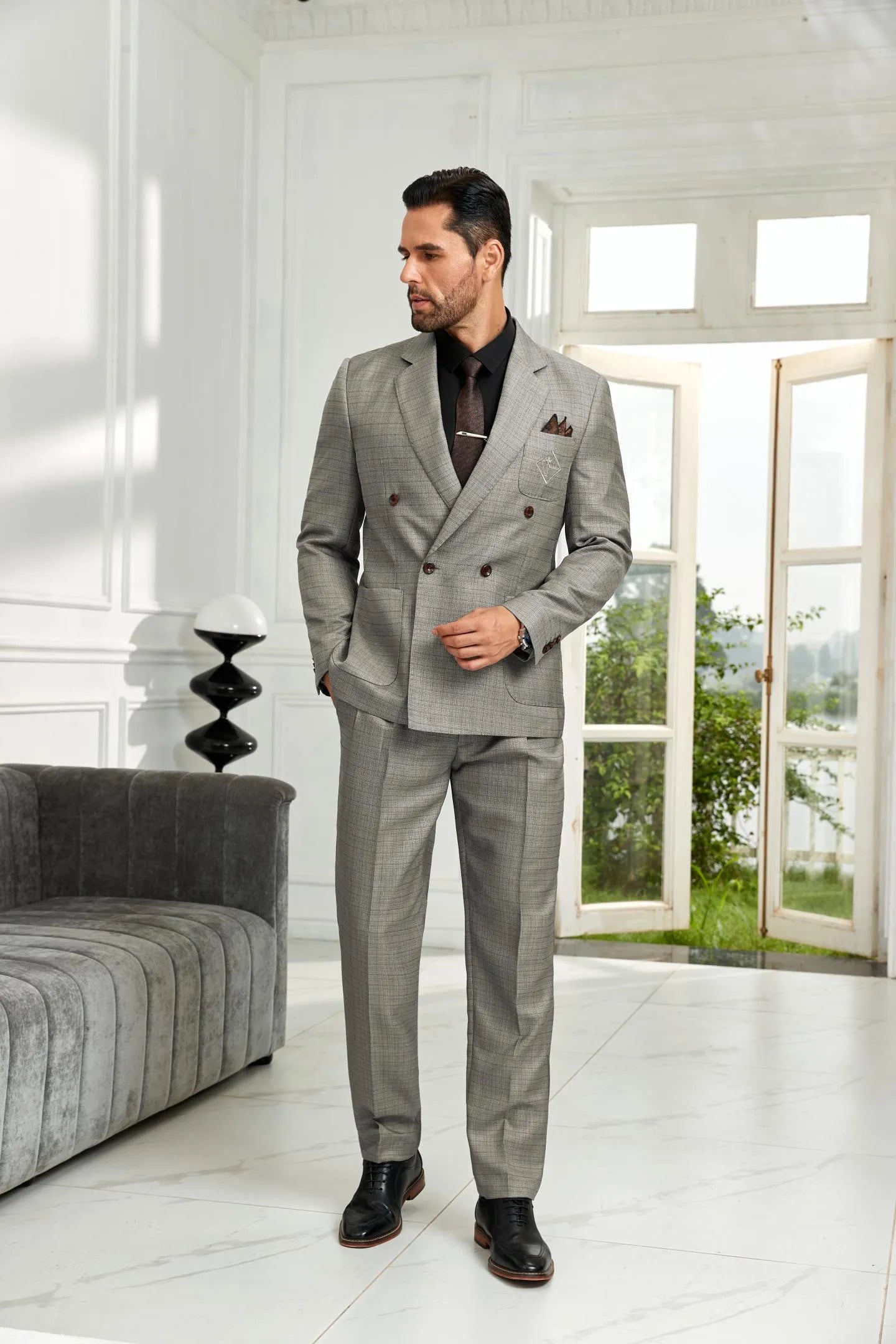grey 2 piece men's formal suit – side angled pose highlighting double breasted blazer and tailored pants