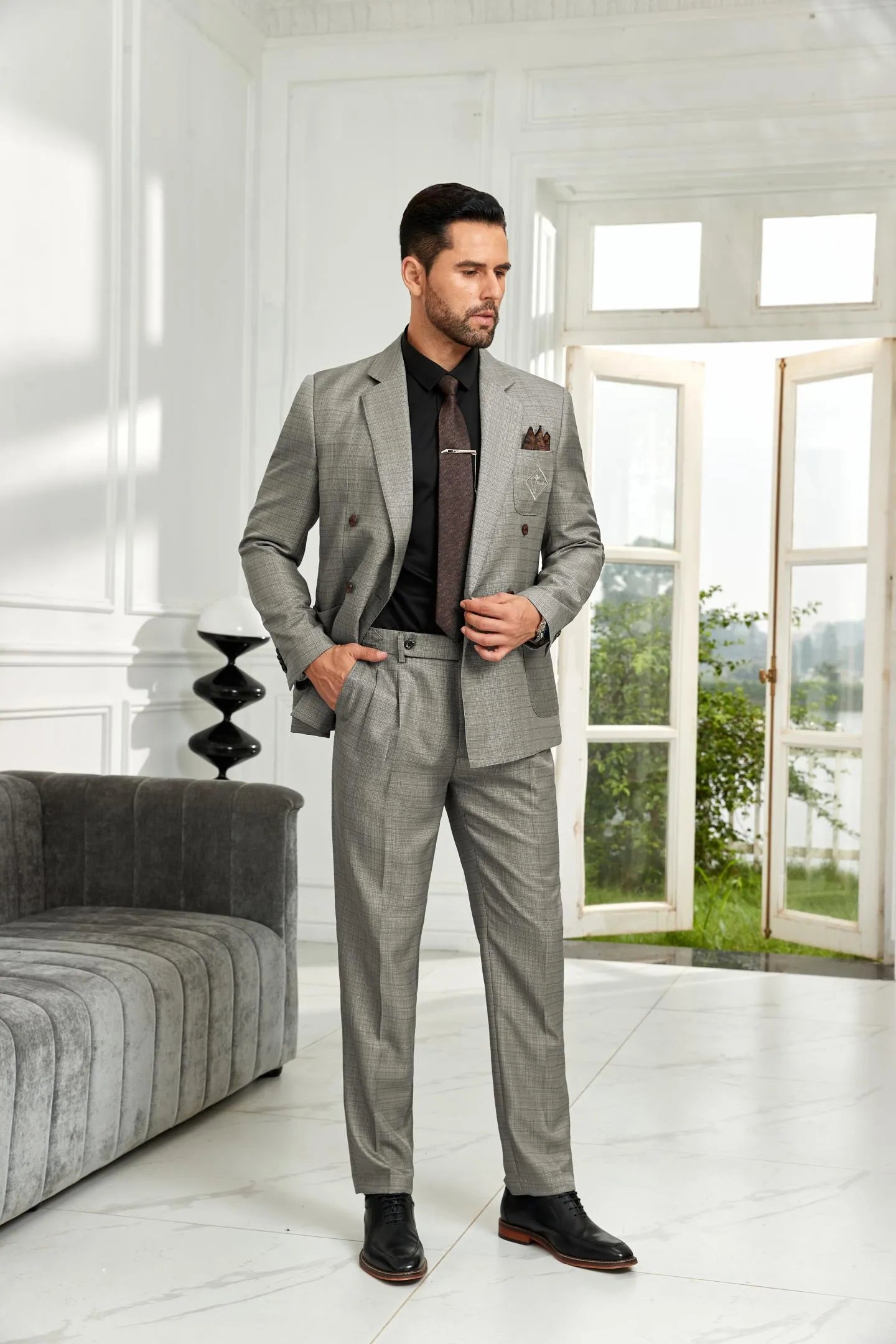 grey double breasted 2 piece men's suit – full body front view with business formal styling, black shirt and tie