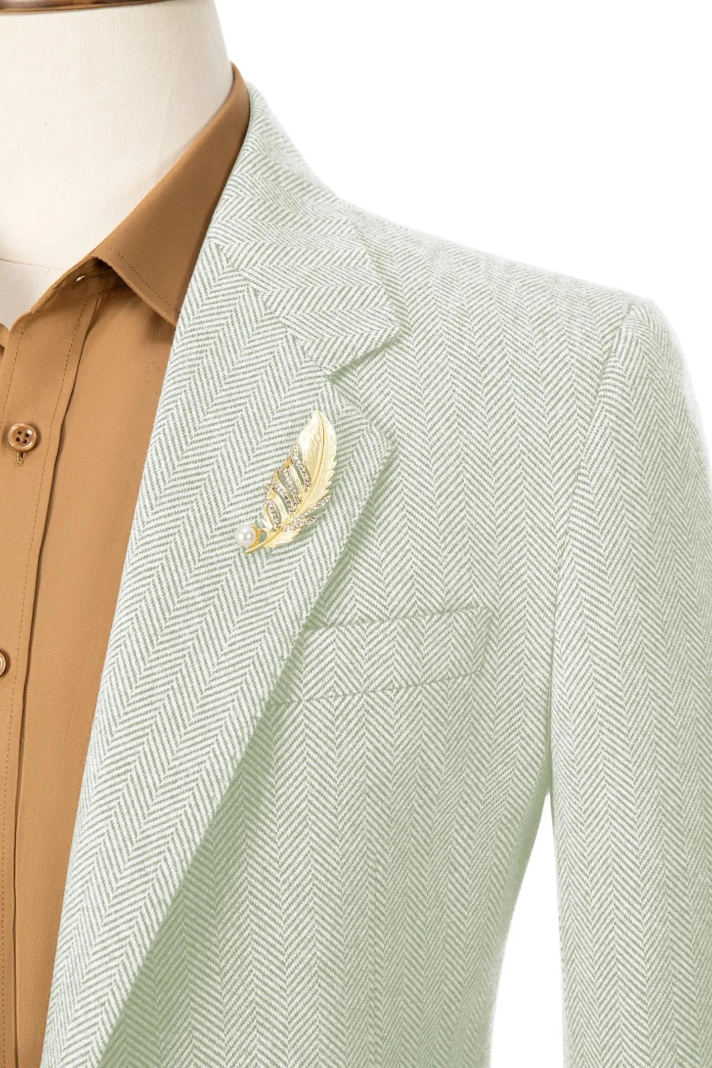 Close-up of the collar on men's light green herringbone business blazer – showcasing refined craftsmanship and style