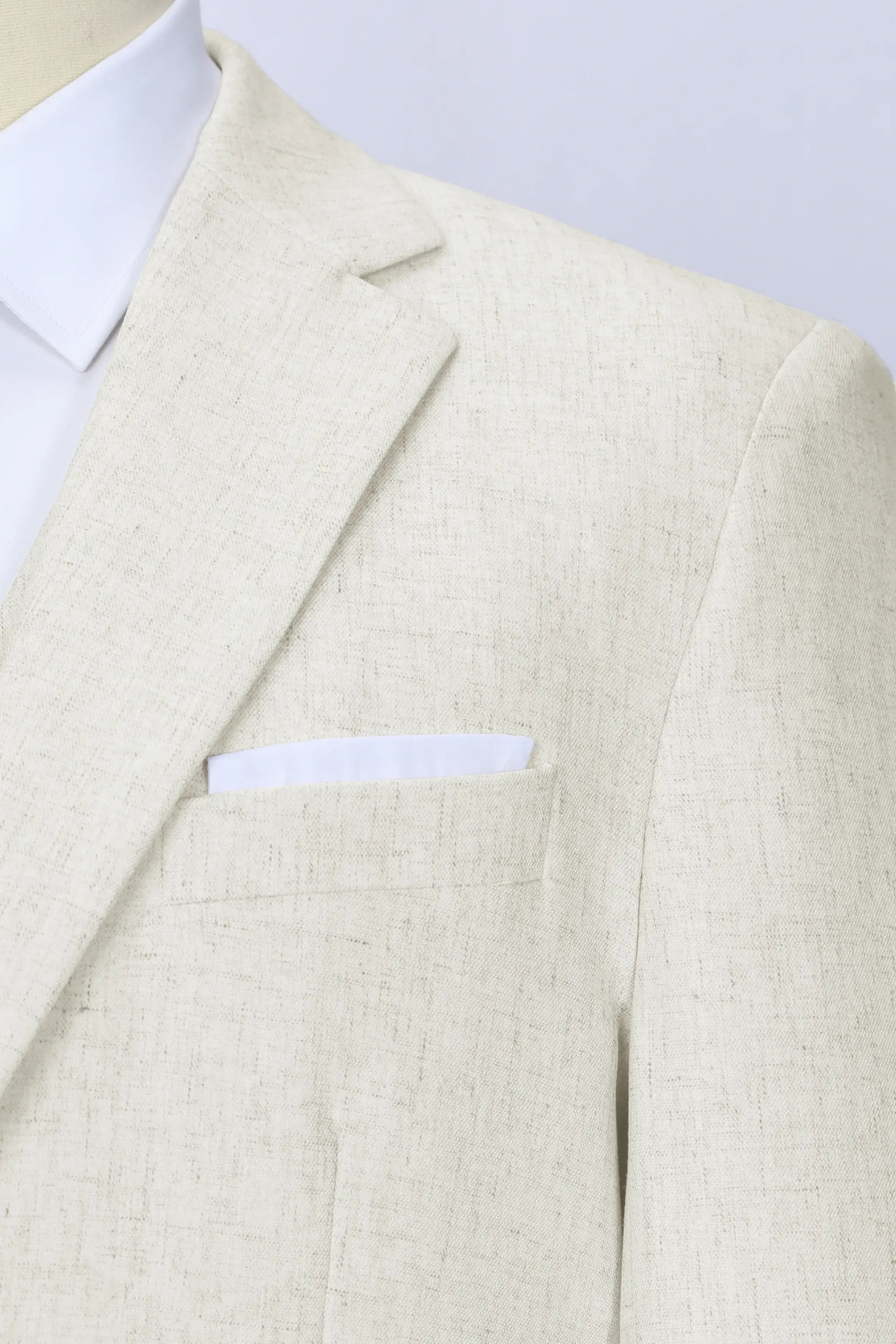 Detailed shot of ivory linen blazer fabric for summer suits