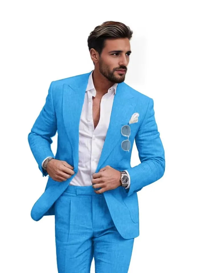 Man in blue slim fit linen 2 piece summer suit with peaked lapel blazer, styled with shirt for formal summer occasions.