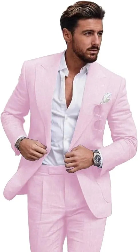 Front view of man in light pink slim fit linen 2 piece summer suit with peaked lapel blazer and trousers, styled for beach weddings or casual events.