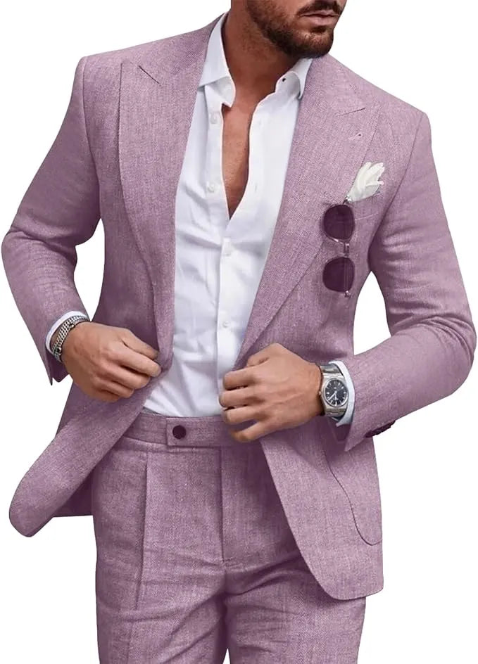 Man in lilac slim fit linen 2 piece summer suit with peaked lapel jacket and trousers, styled with white shirt for weddings or summer parties.