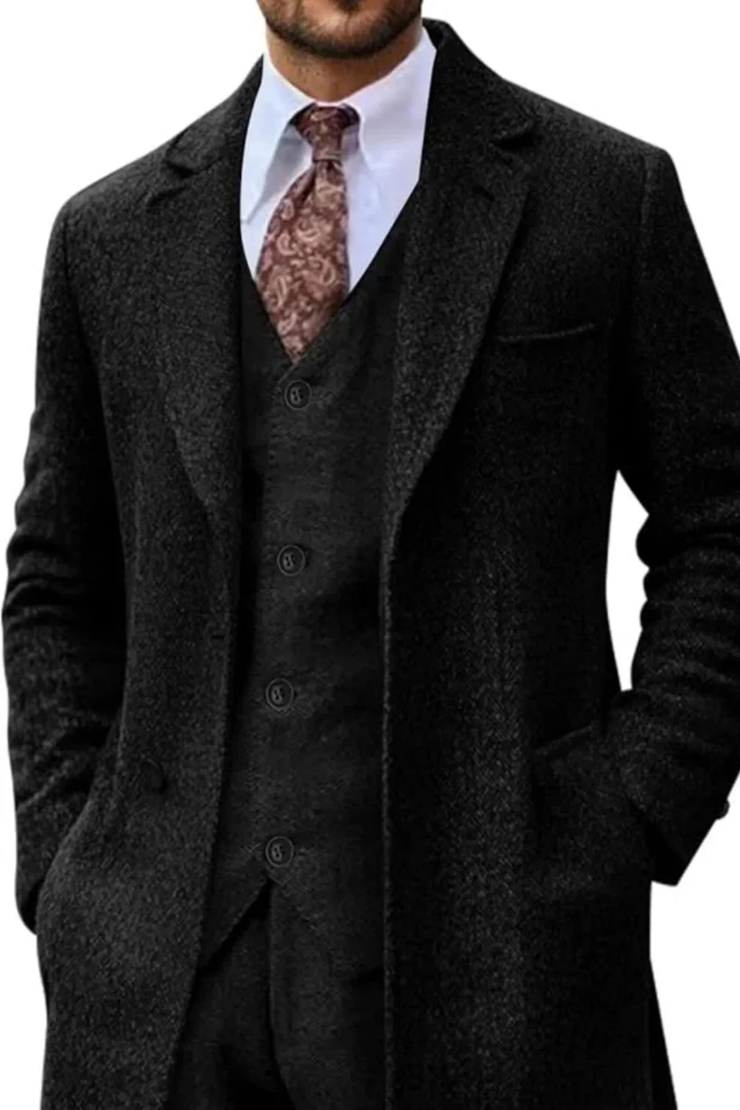 close-up of men's black retro herringbone 3 piece suit with long tweed blazer, paisley tie, and white shirt for formal occasions.