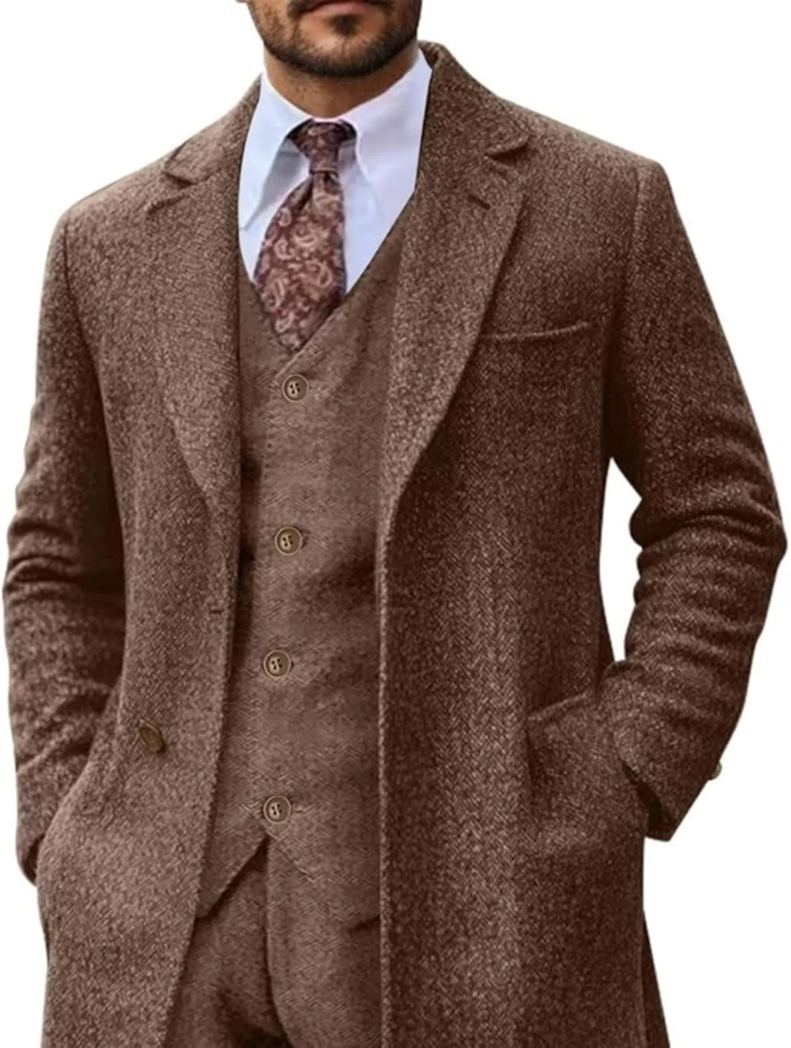 brown herringbone 3 piece suit with long blazer, front view, paired with paisley tie and white shirt.