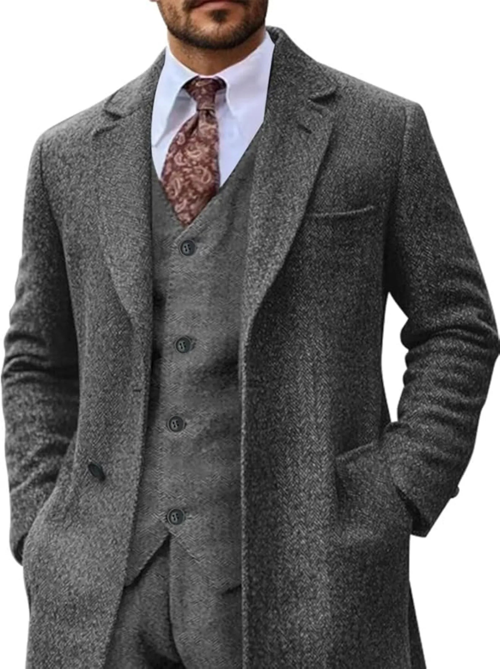 men's grey herringbone 3 piece suit with long tweed blazer, styled with patterned tie and white shirt front view.