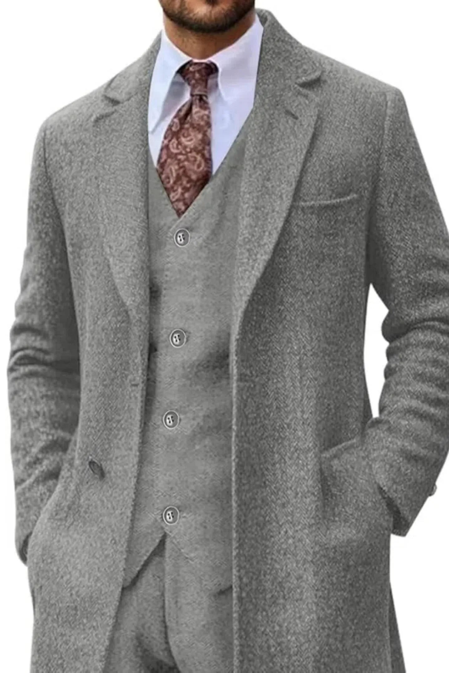 light gray retro herringbone 3-piece suit with long tweed blazer, styled with paisley tie and white shirt, formal menswear look.