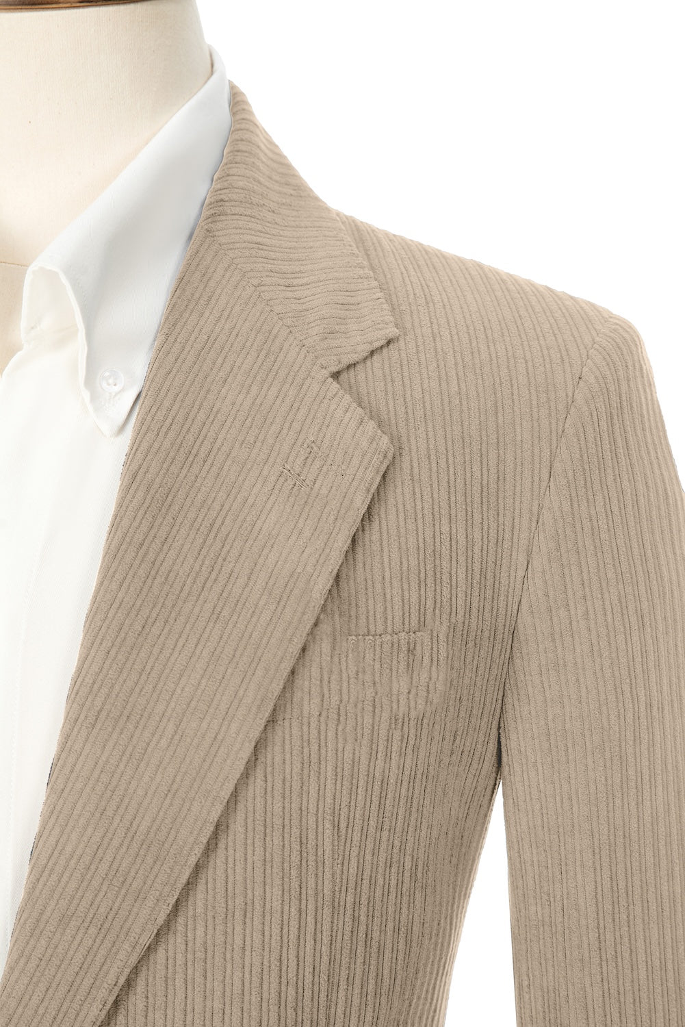 Close-up of beige corduroy prom blazer lapel – textured fabric, elegant cut