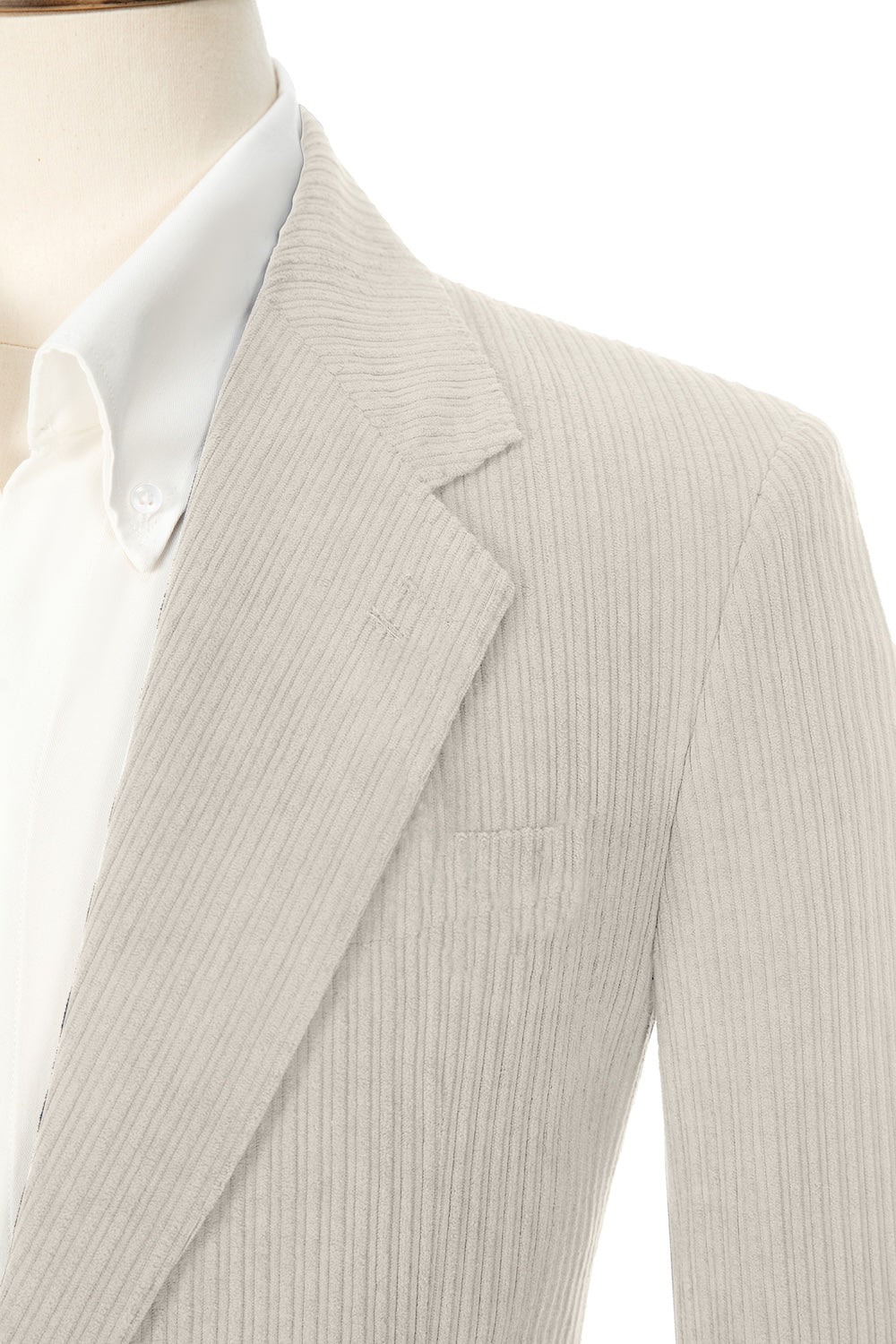 Close-up of beige grey corduroy prom blazer lapel – textured fabric, elegant cut