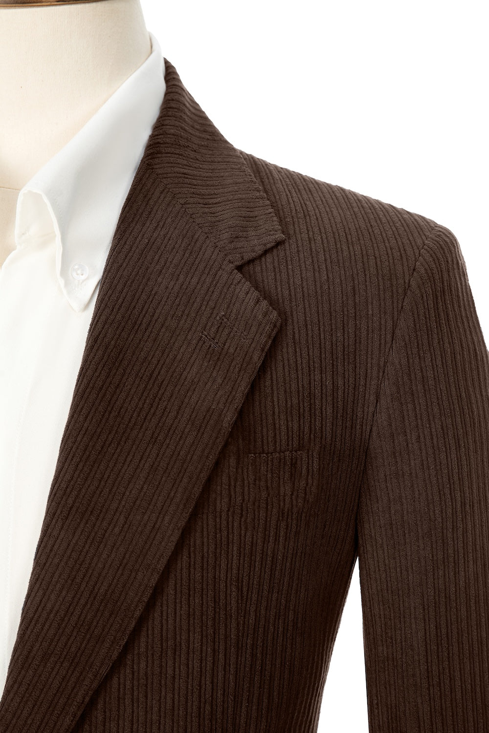 Close-up of coffee corduroy prom blazer lapel – textured fabric, elegant cut