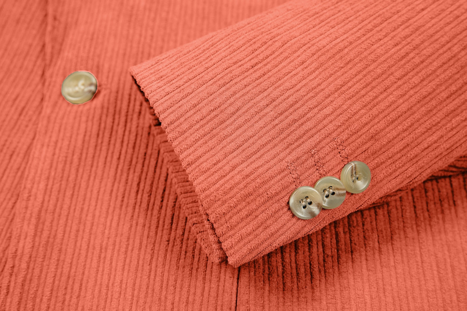 Cuff detail of coral corduroy prom blazer – formal sleeve with neat finish