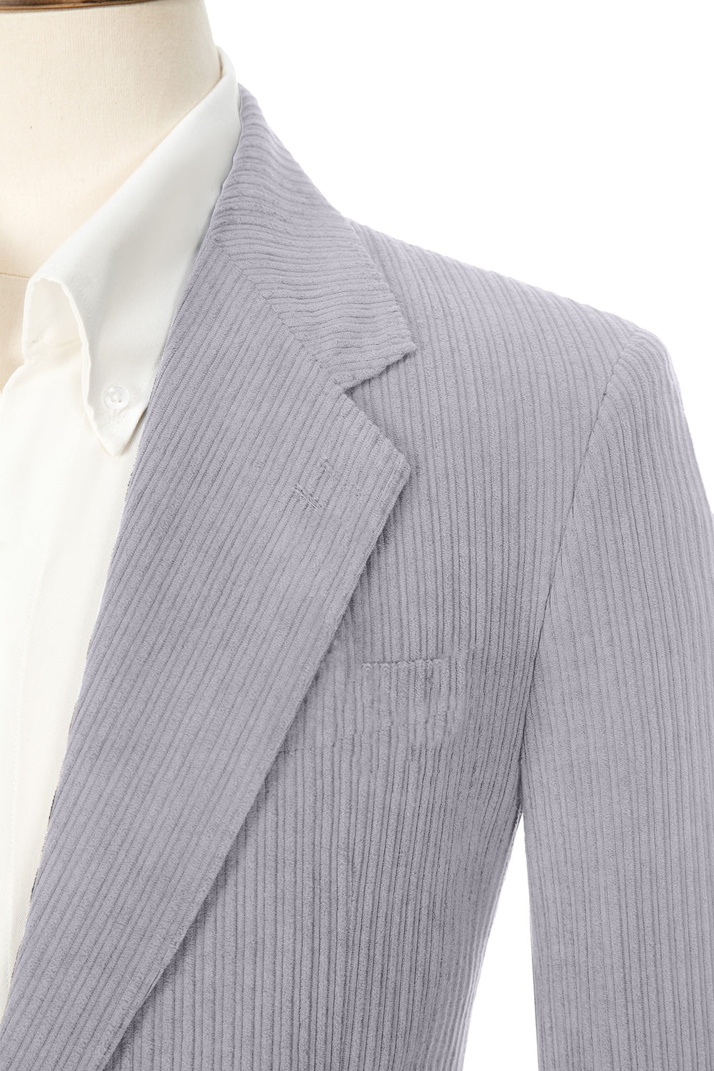 Close-up of grey purple corduroy blazer lapel – textured fabric with clean lines