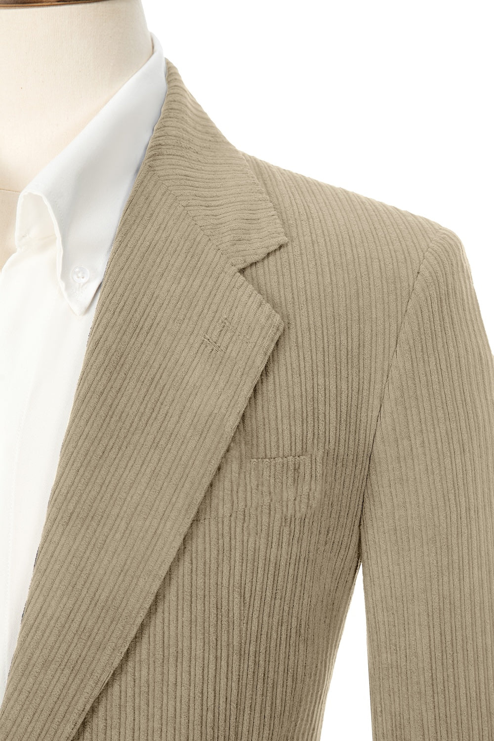 Close-up of oatmeal corduroy prom blazer lapel – textured fabric, elegant cut