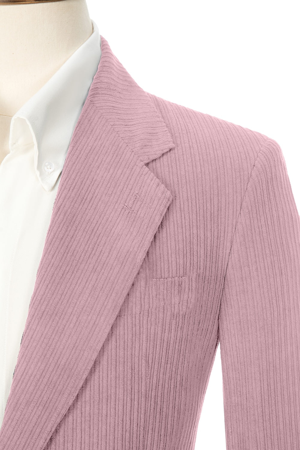 Close-up of pink corduroy prom blazer lapel – textured fabric, elegant cut