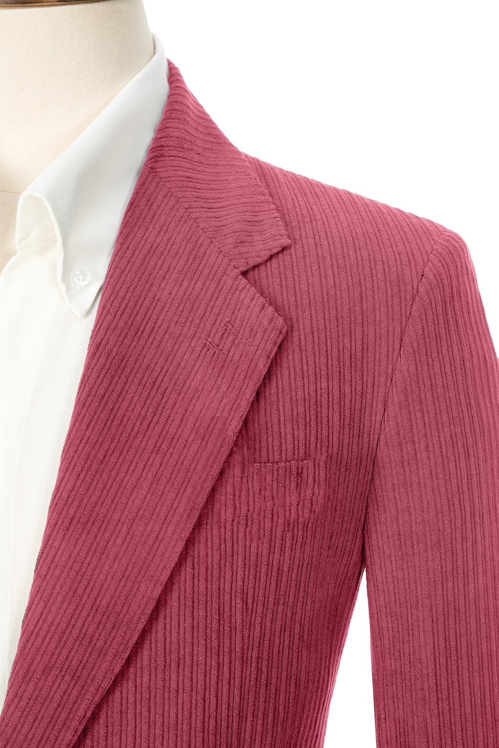 Close-up of rose red corduroy prom blazer lapel – textured fabric, elegant cut
