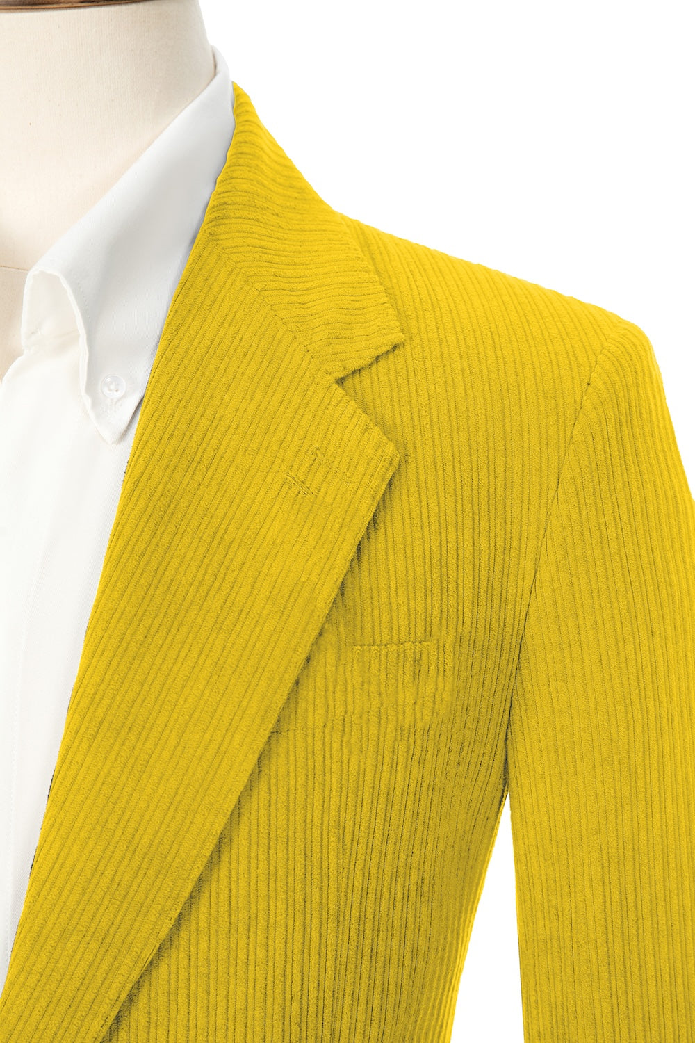 Close-up of yellow corduroy prom blazer lapel – textured fabric, elegant cut
