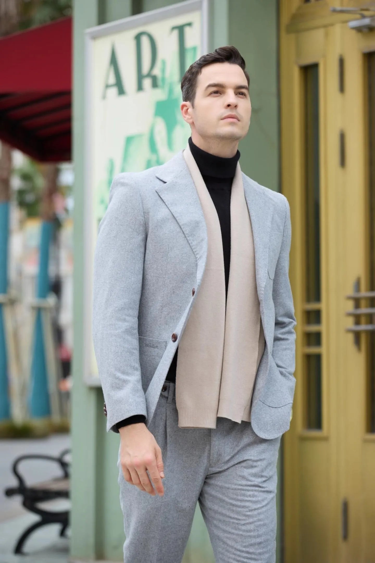 side view of men's gray herringbone 2 piece two-button suit, perfect for casual business attire.