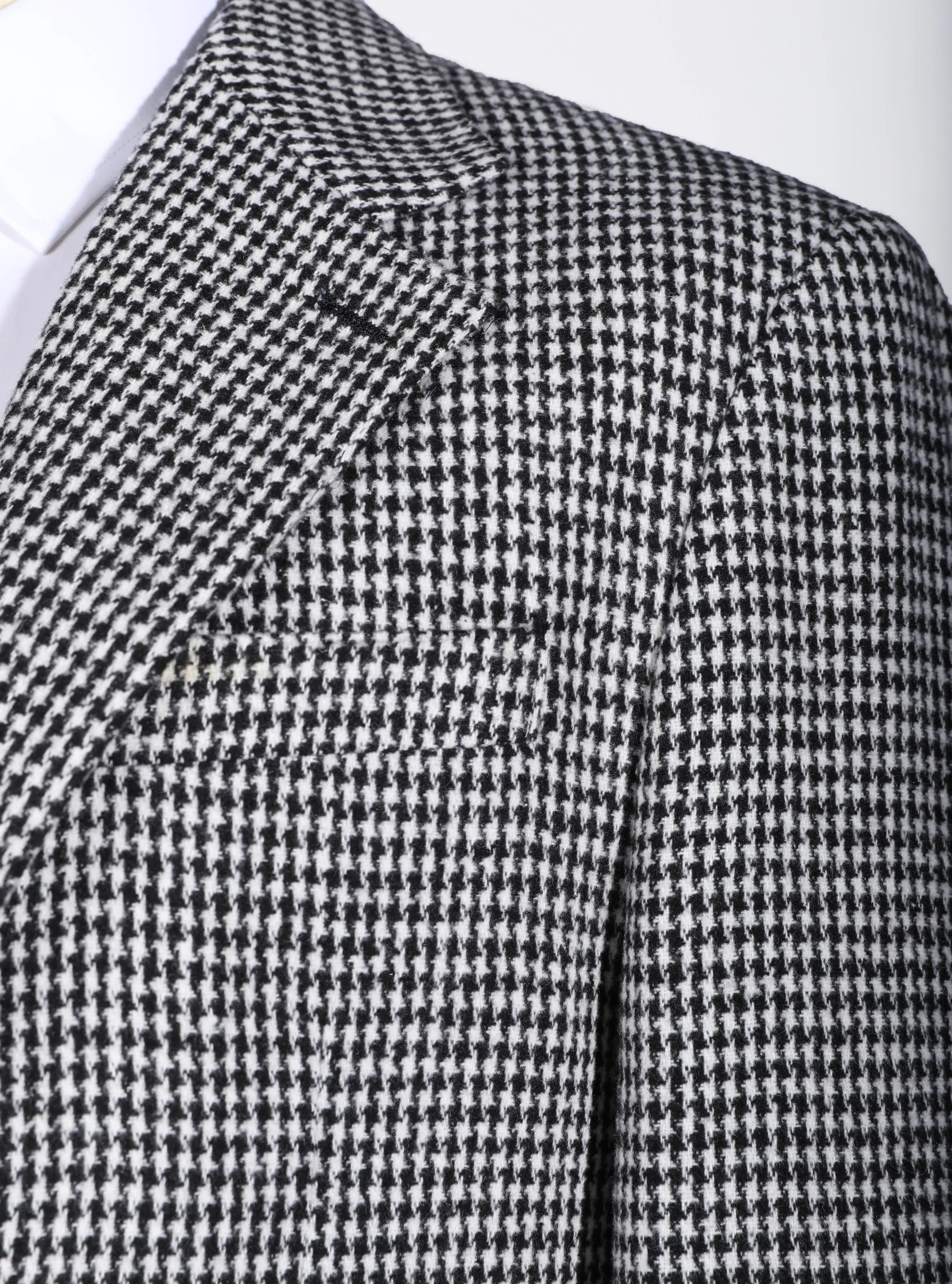 Detailed front look at classic houndstooth three piece men's suit