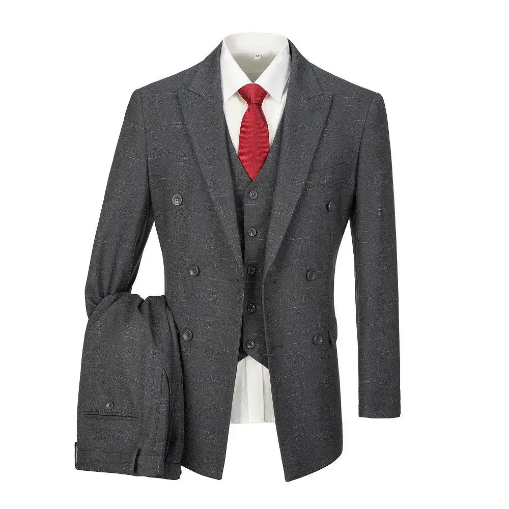 Three-piece grey plaid men's suit styled with red tie and folded jacket