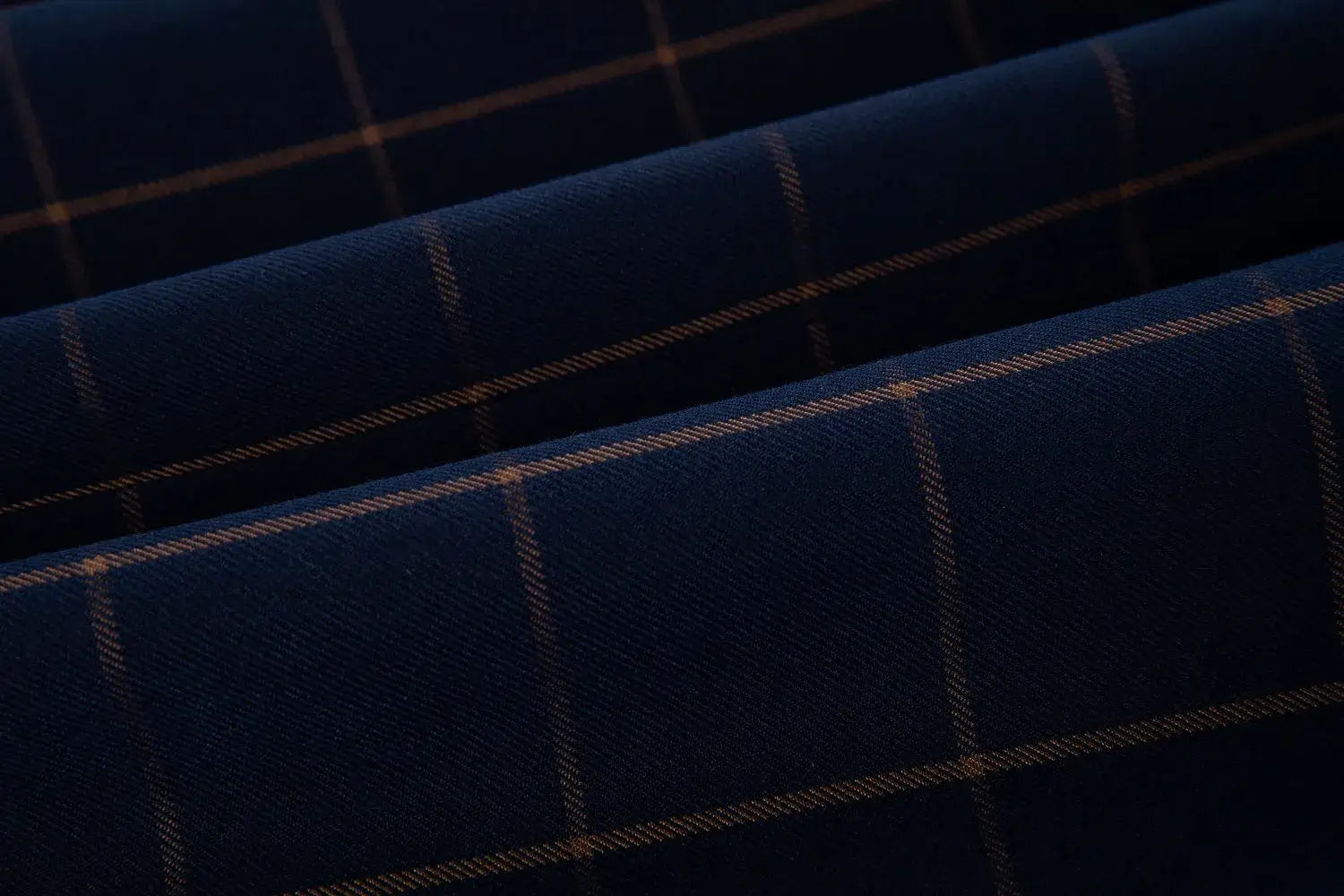 Close-up of orange plaid pattern on blue fabric from men's 3-piece suit