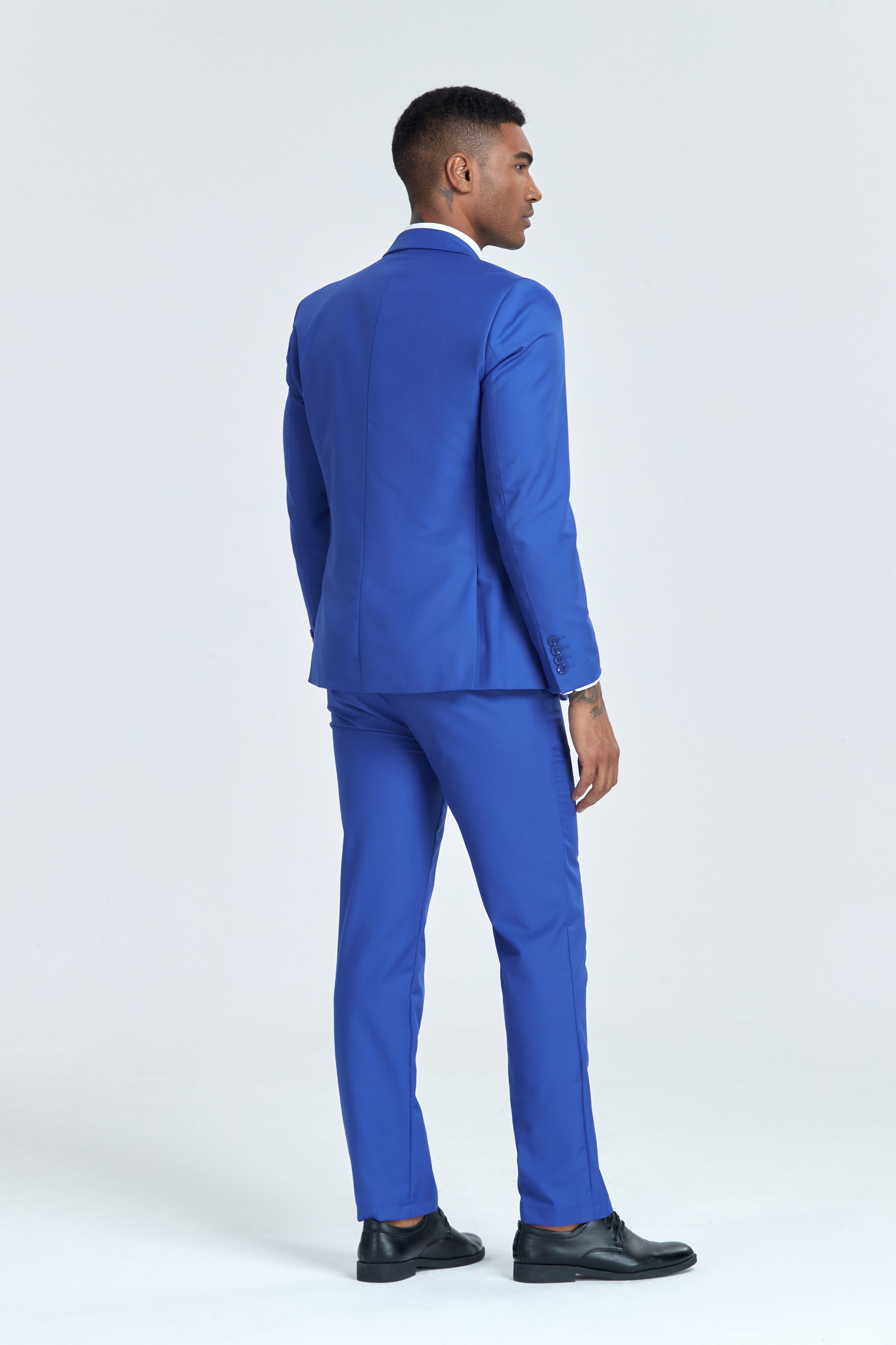 Back view of royal blue suit showing smooth tailoring and structured fit