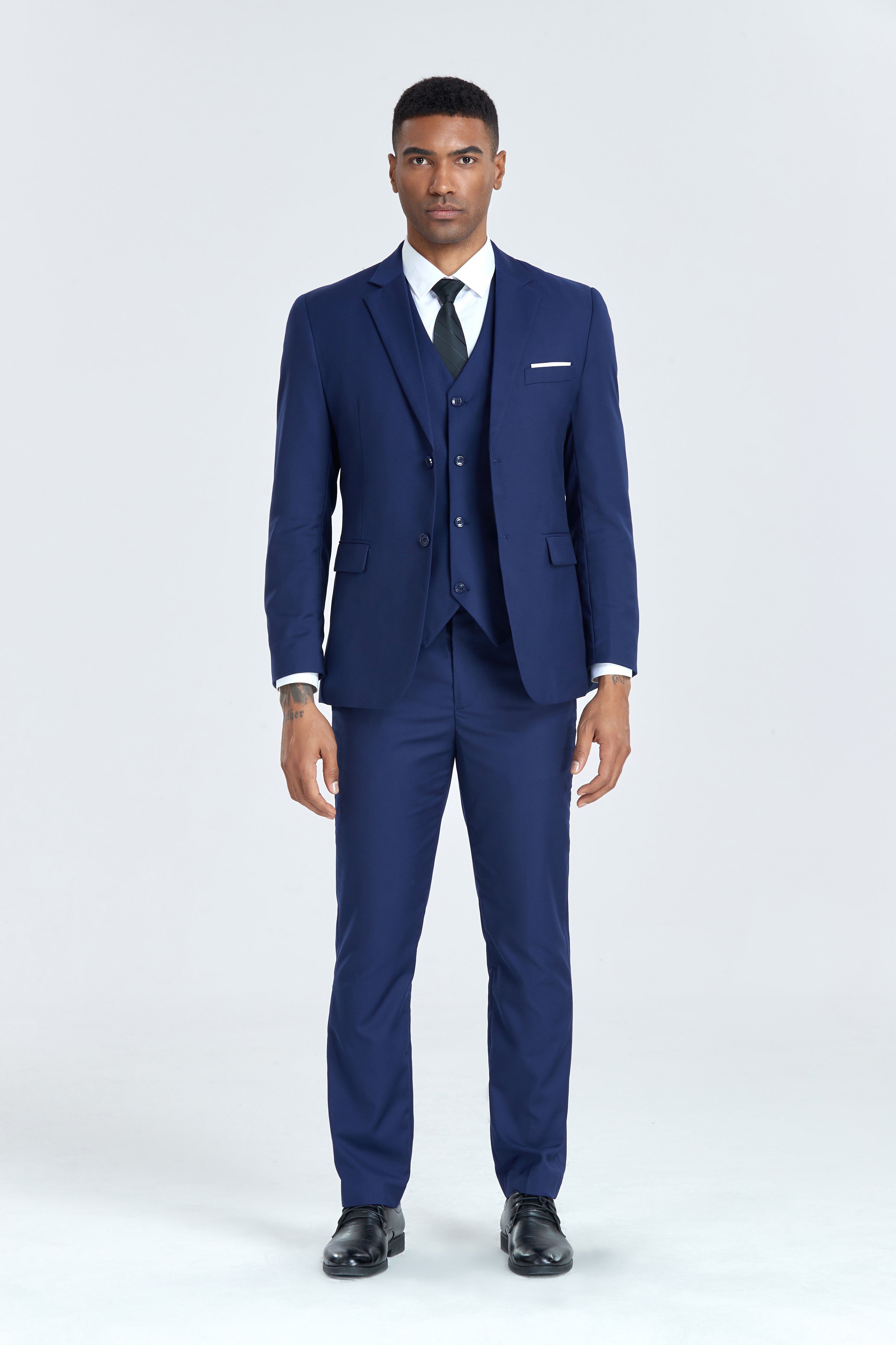 Navy white 3 piece men’s suit with notch lapel, black tie and white shirt