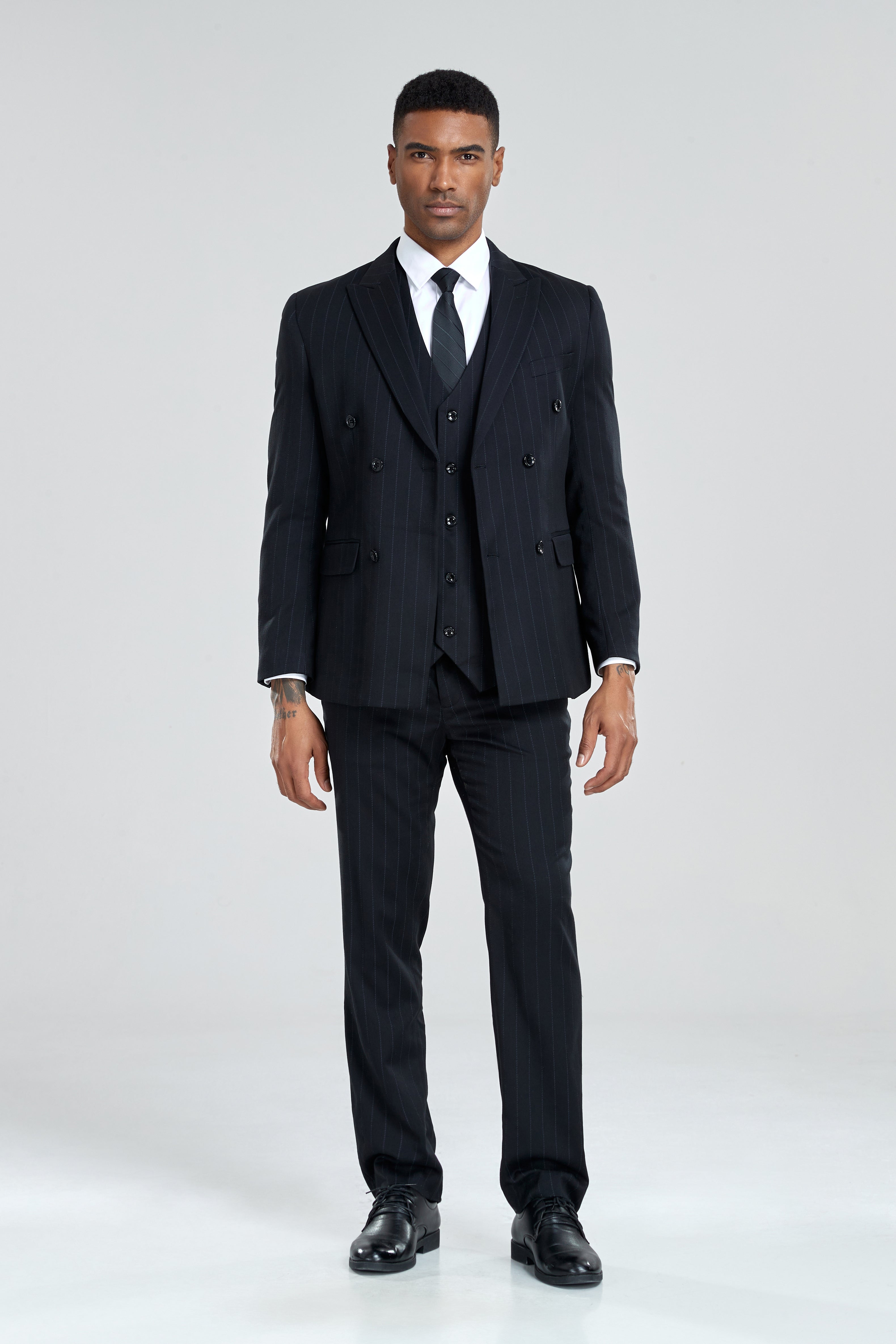 Front-facing view of black striped suit with classic double-breasted cut