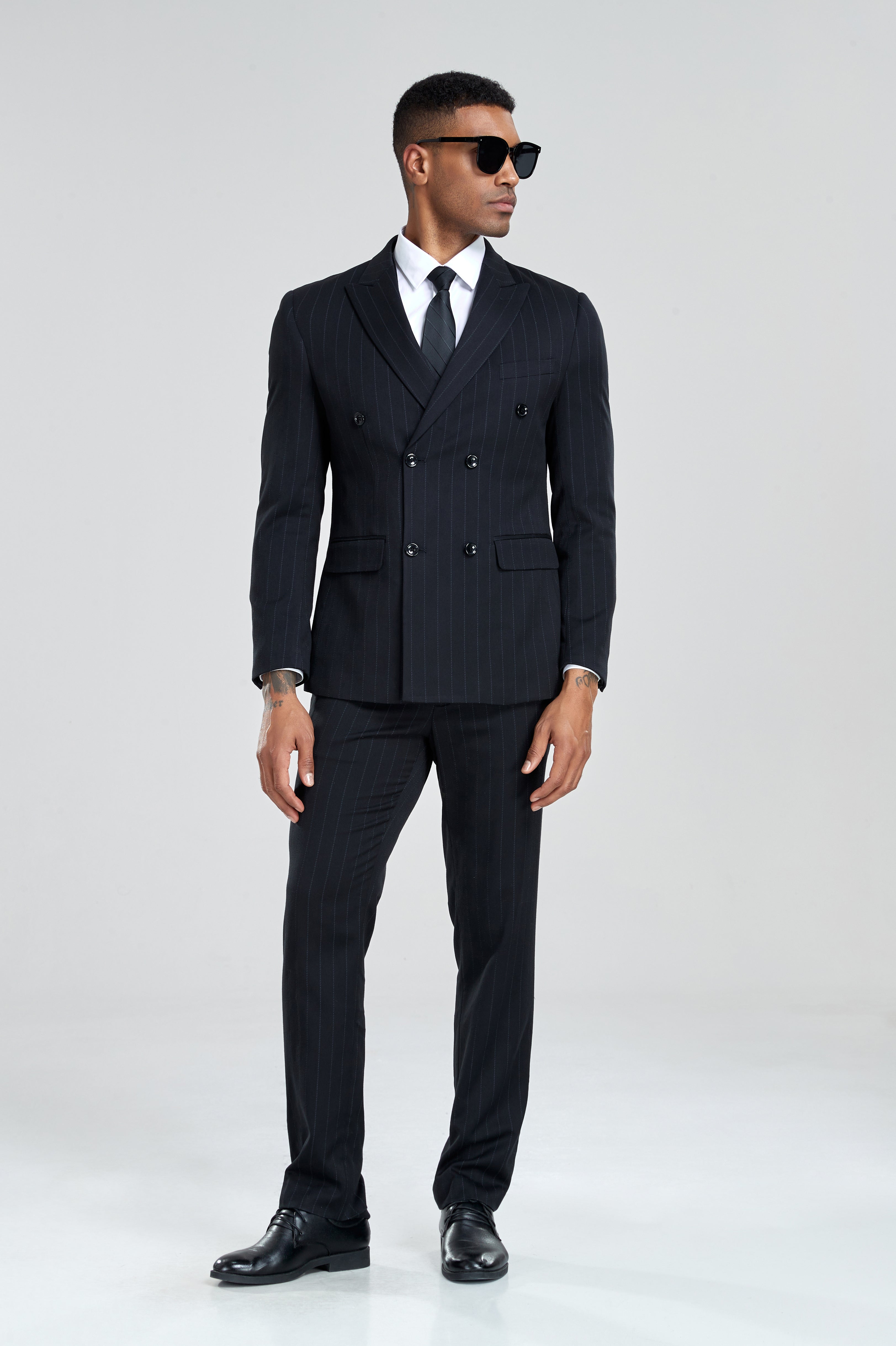 Classic black pinstripe suit with structured shoulders and notch lapels