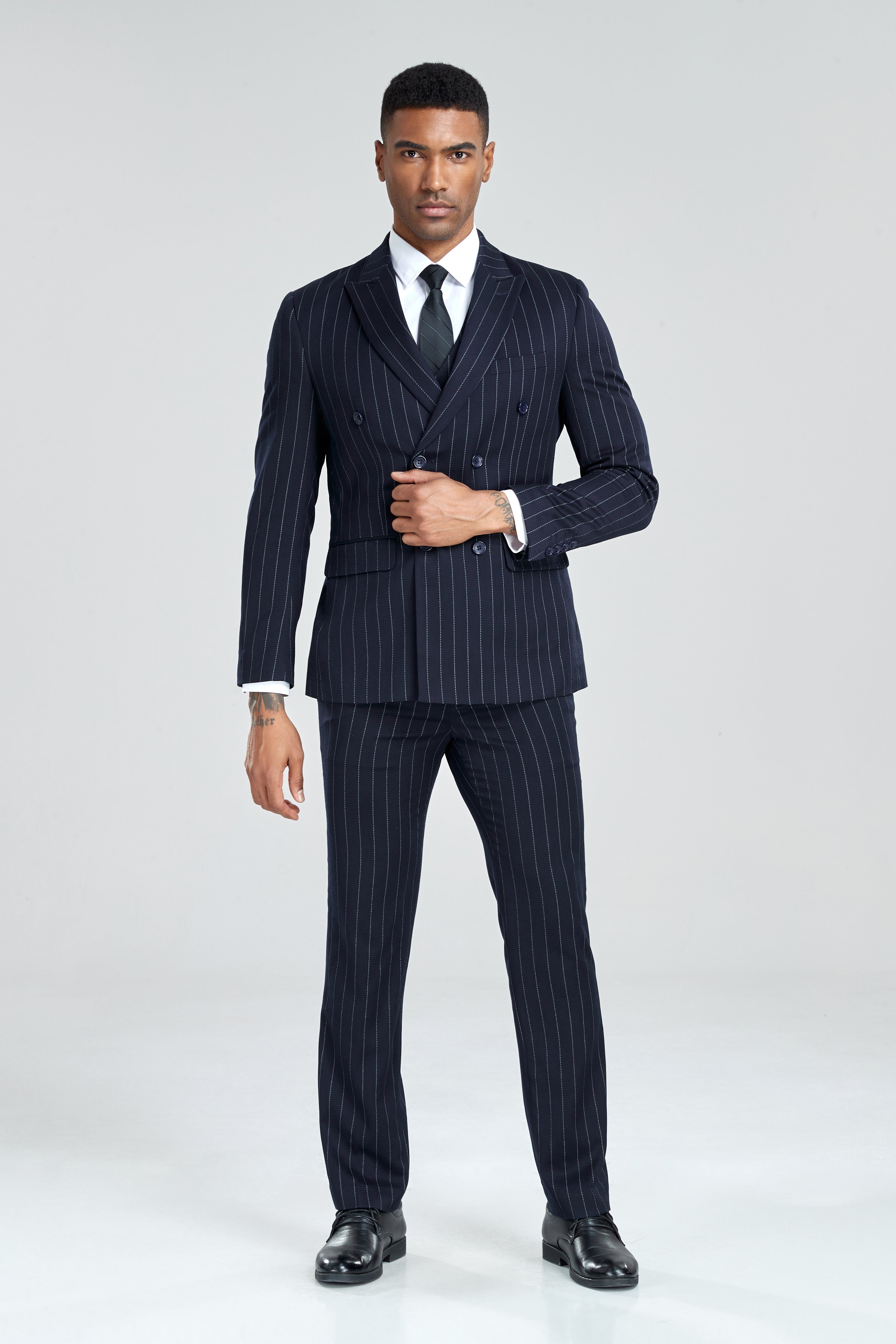 Double-breasted navy striped suit with vest, styled for retro formal menswear looks
