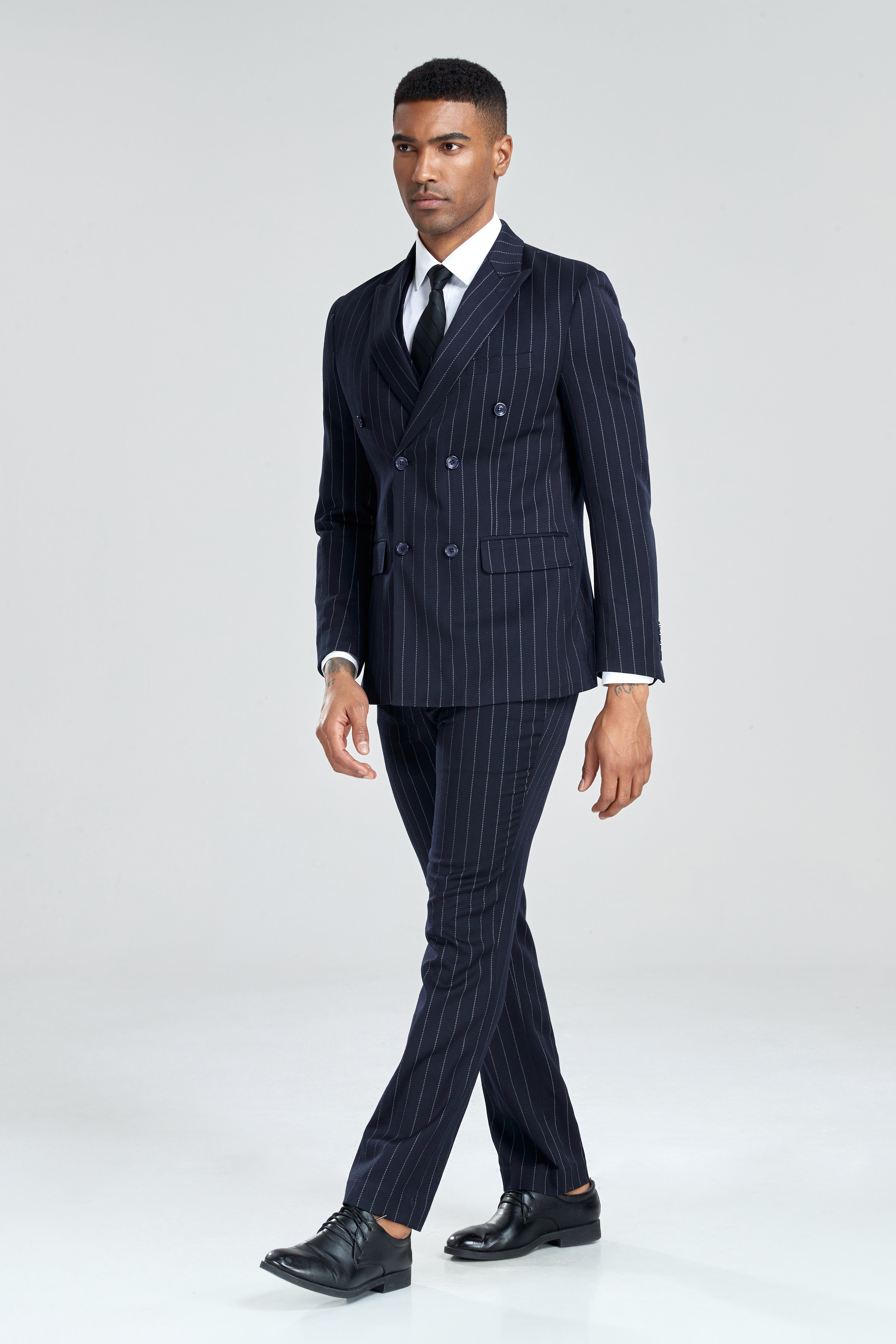 Classic men's navy chalk stripe suit with sharp tailoring and formal 3 piece styling