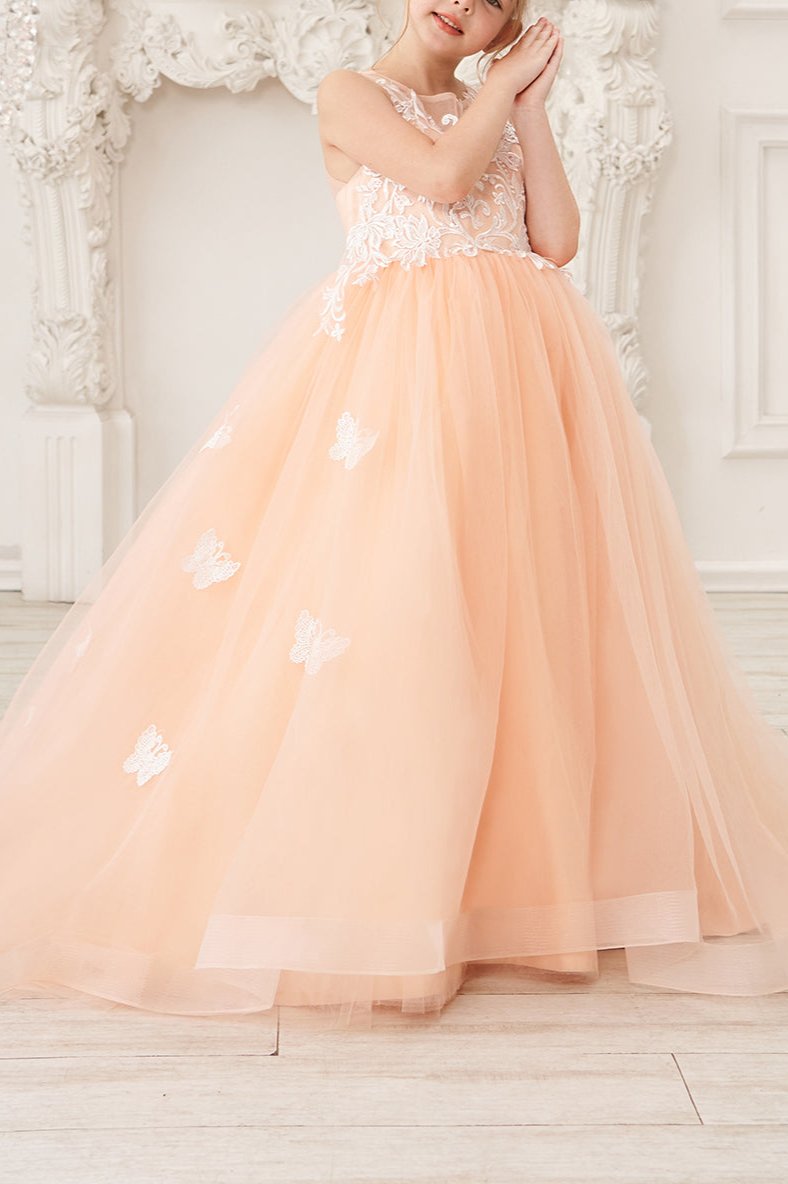 Wehilion applique tulle princess gown in peach with butterfly accents and flowing skirt