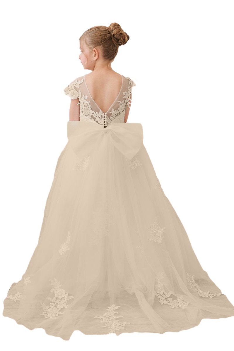 Wehilion flower girl tulle dress in beige with floral lace accents and a large bow at the back